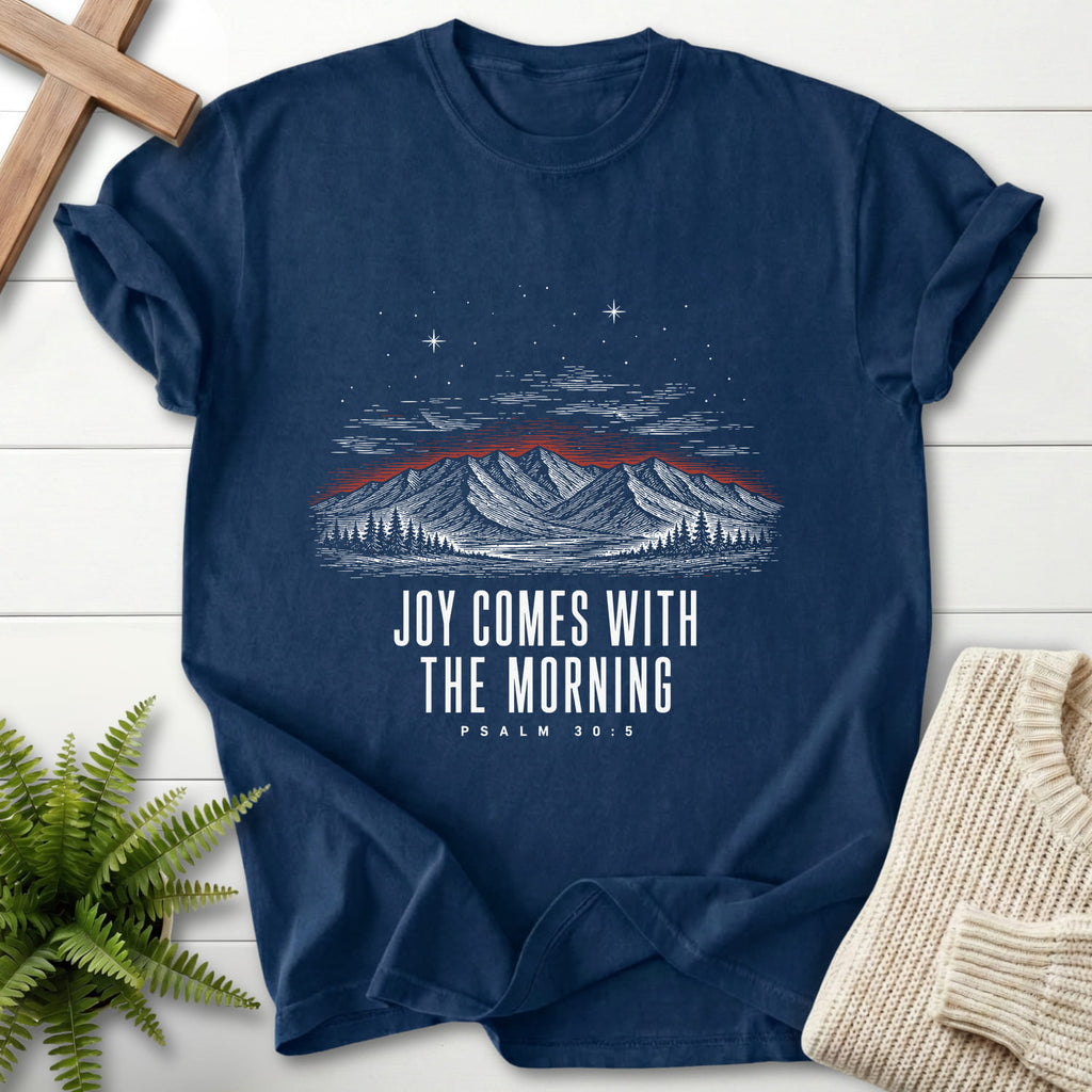 Flatlay of a Navy Bible verse tee with mountain graphic with "Joy Comes With the Morning Mountain T-Shirt" Psalm 30:5.