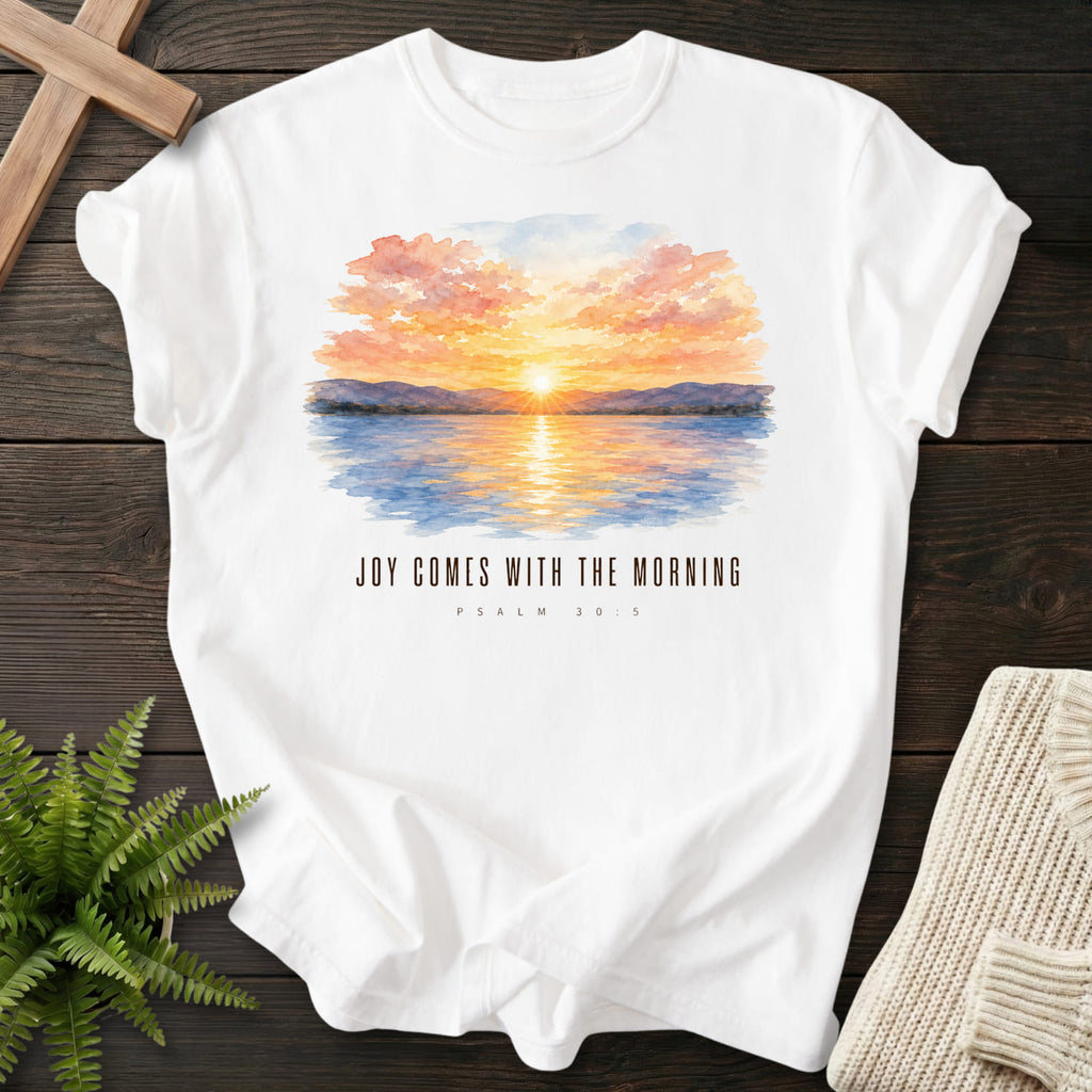 Flat lay of a White Comfort Colors 1717 garment-dyed Christian tee featuring watercolor artwork with "Joy Comes With the Morning T-Shirt".
