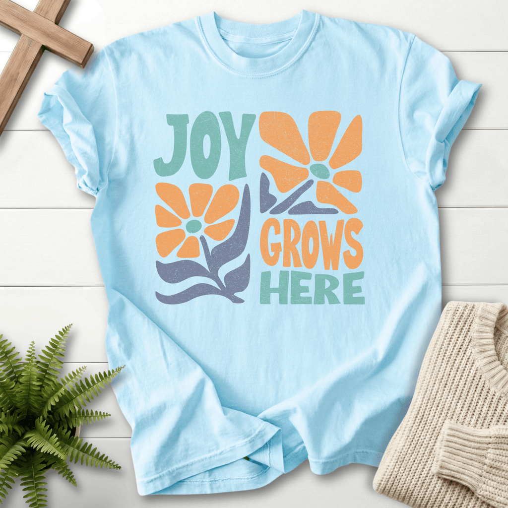 Chambray women's Christian t-shirt with groovy teal and orange "Joy Grows Here" floral design