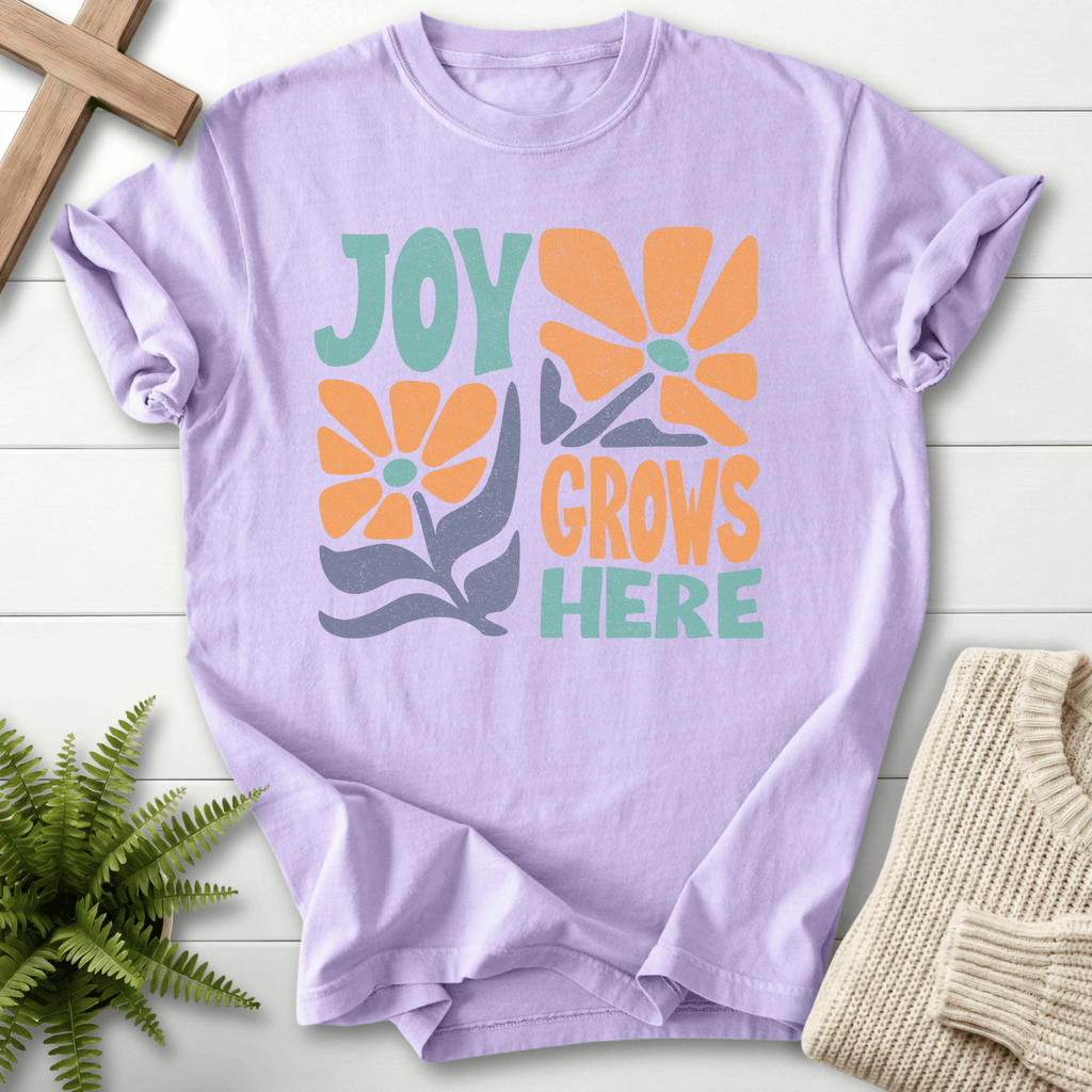 Orchid women's Christian t-shirt with a retro orange and teal "Joy Grows Here" floral design