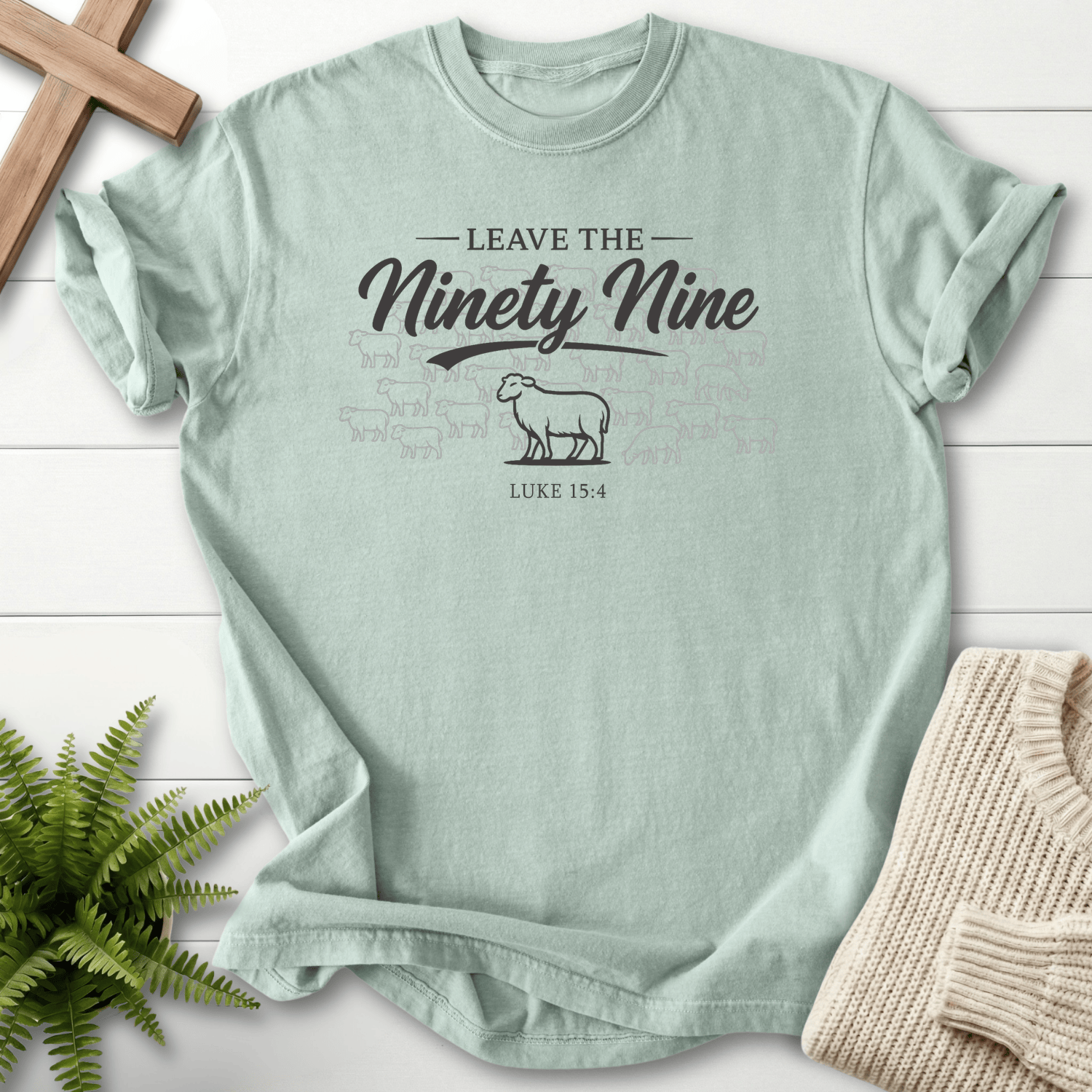 Bay women's Christian t-shirt with shepherd parable sheep graphic and "Leave the Ninety Nine" script, inspired by Luke 15:4.