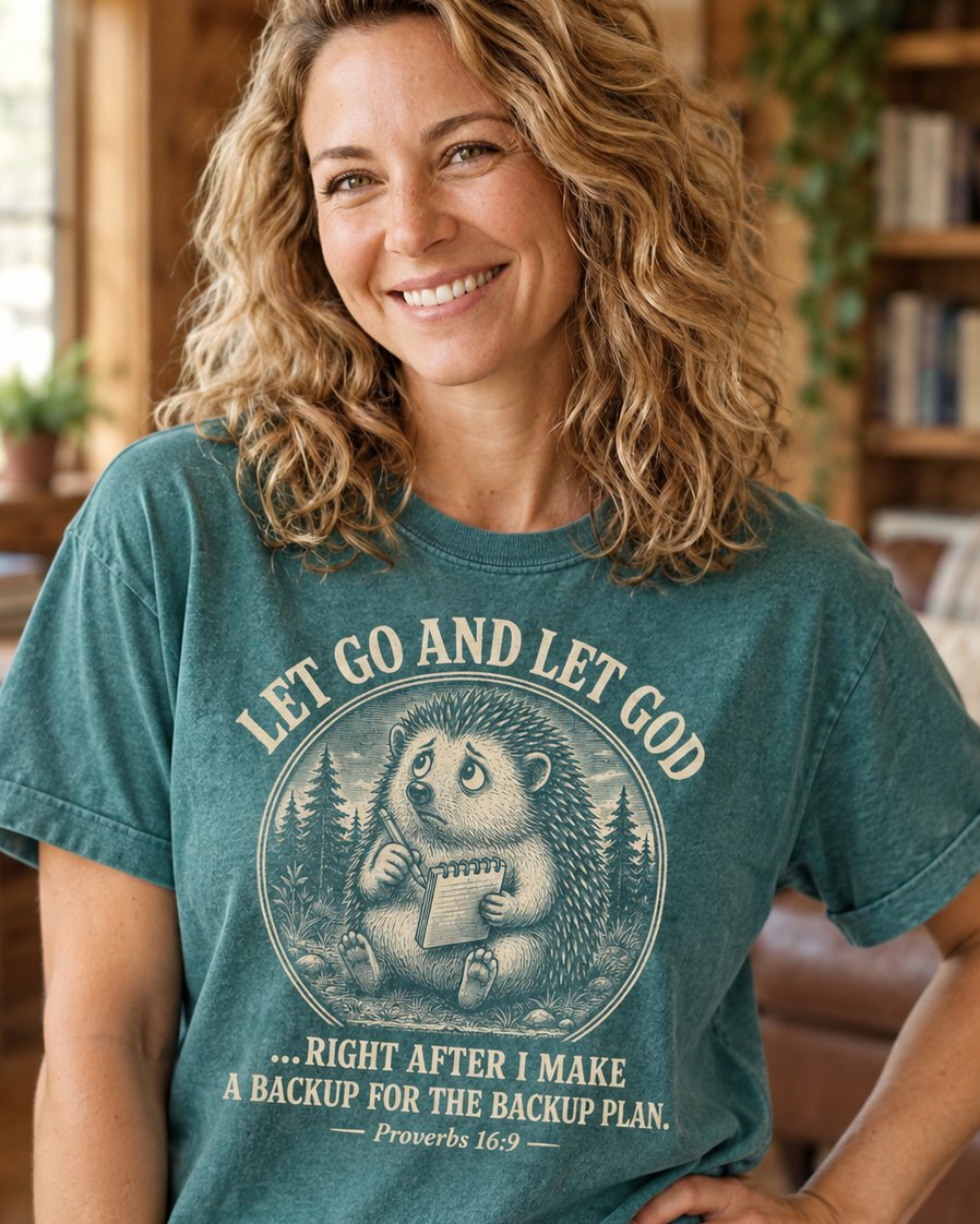 Let Go And Let God Backup Plan, Blue Spruce women's Christian tee, lifestyle photo in cozy living room, Worried hedgehog with a notepad and funny backup plan text, Proverbs 16:9, She Wears Faith
