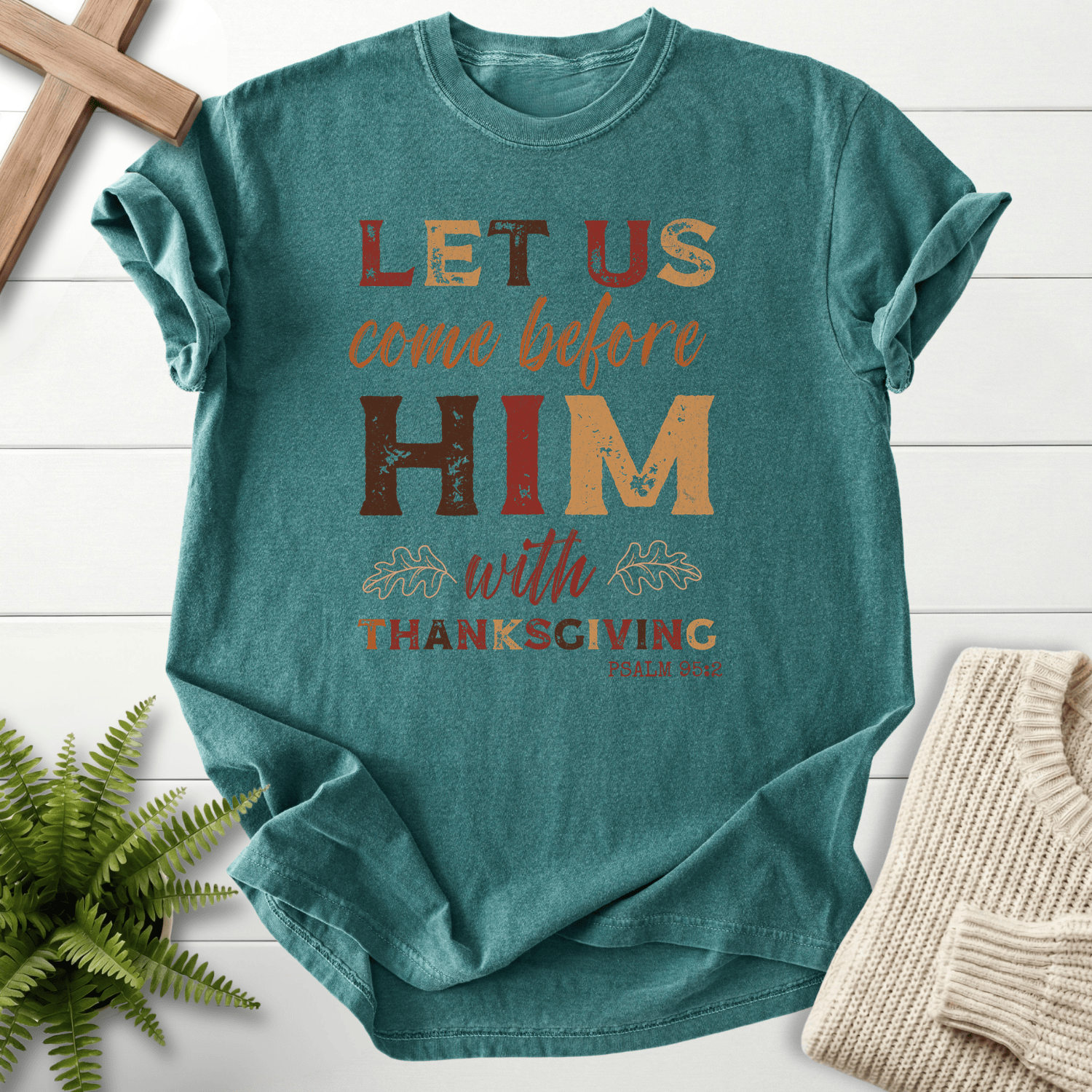 Blue Spruce Christian t-shirt for women with Let Us Come Before Him With Thanksgiving lettering and oak leaf accents, inspired by Psalm 95:2.