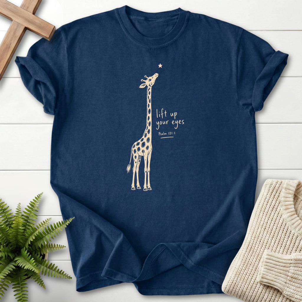 Flat lay of a Navy Scripture shirt featuring "Lift Up Your Eyes Giraffe T-Shirt" Psalm 121:1.