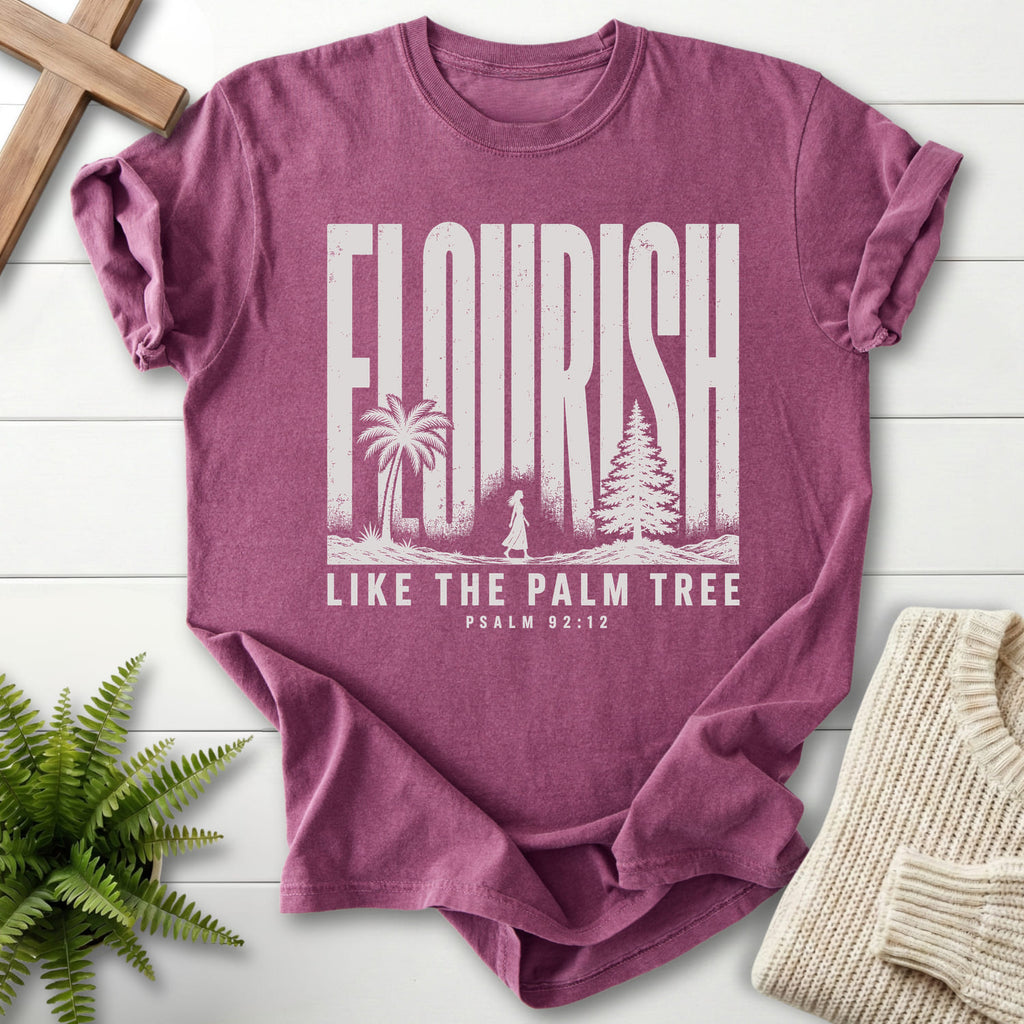 Flat lay of a Berry faith-based tee featuring "Like The Palm Flourish Scripture T-Shirt" Psalm 92:12.