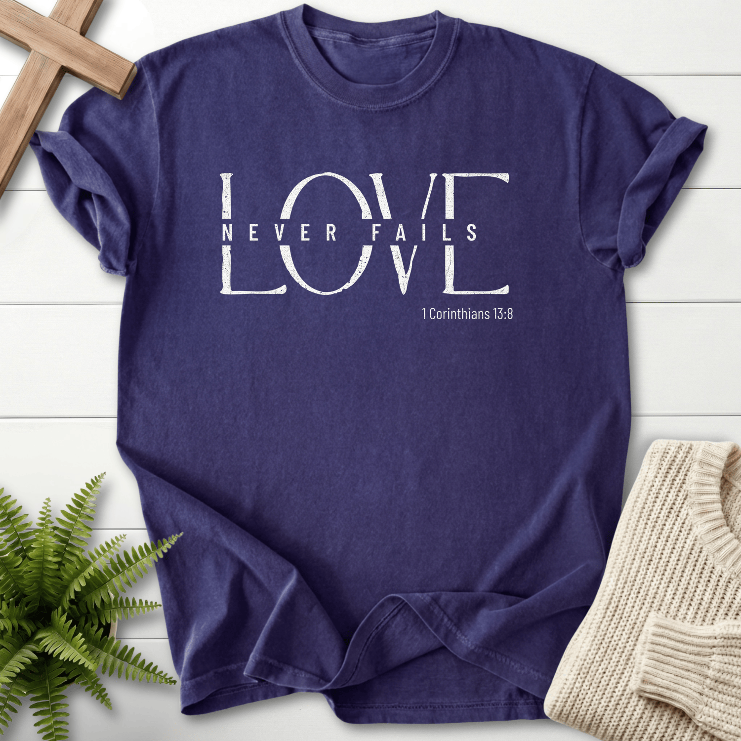 Grape Scripture shirt with distressed LOVE typography, inspired by 1 Corinthians 13:8.