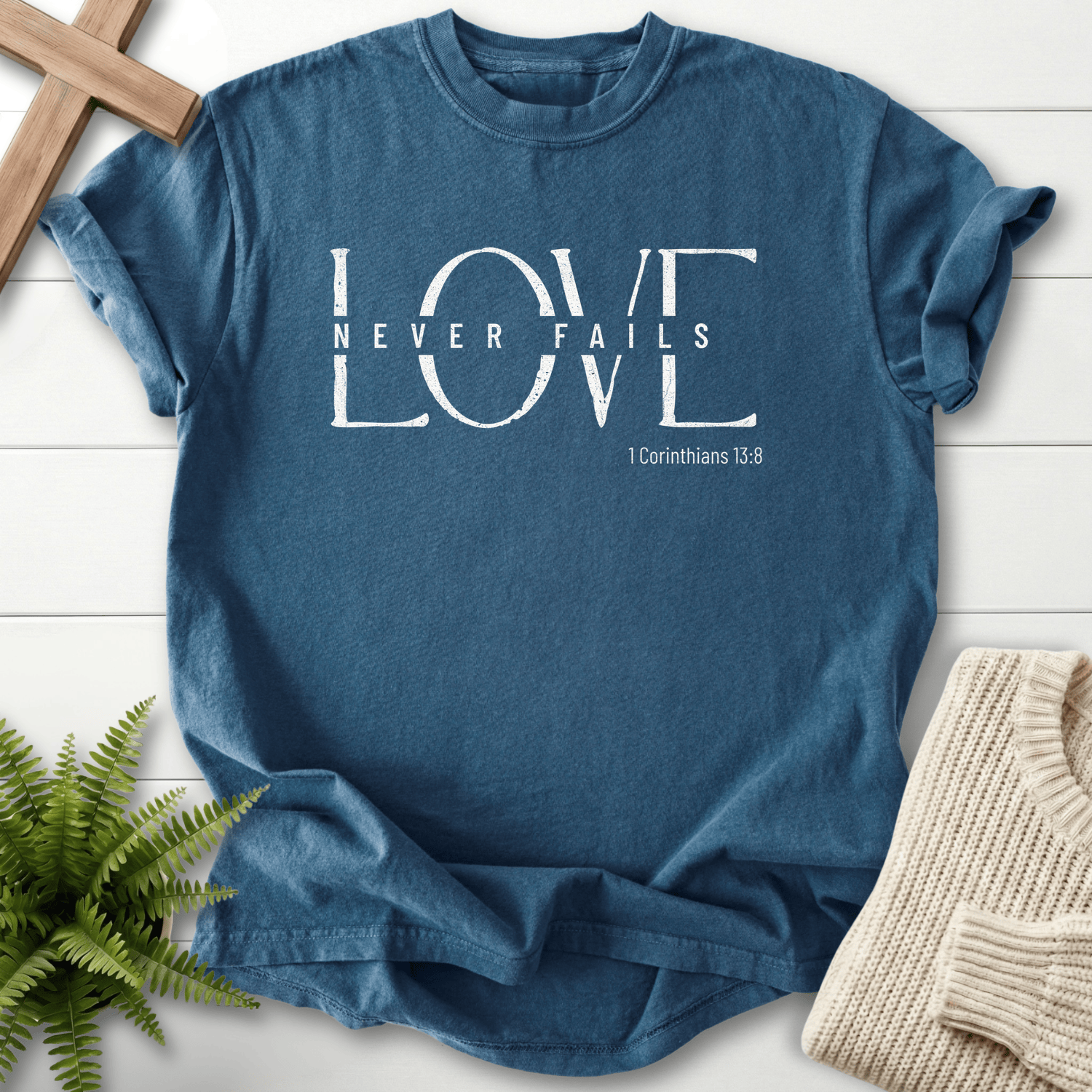 Midnight women's Christian t-shirt with distressed block LOVE graphic, inspired by 1 Corinthians 13:8.