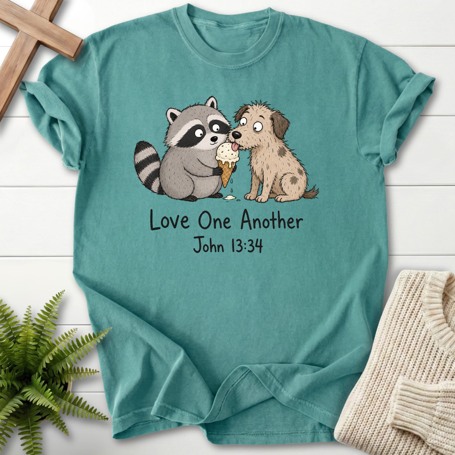Chalky Mint color option for the Love One Another Raccoon Christian shirt with "Love One Another Raccoon Puppy T-Shirt" John 13:34.