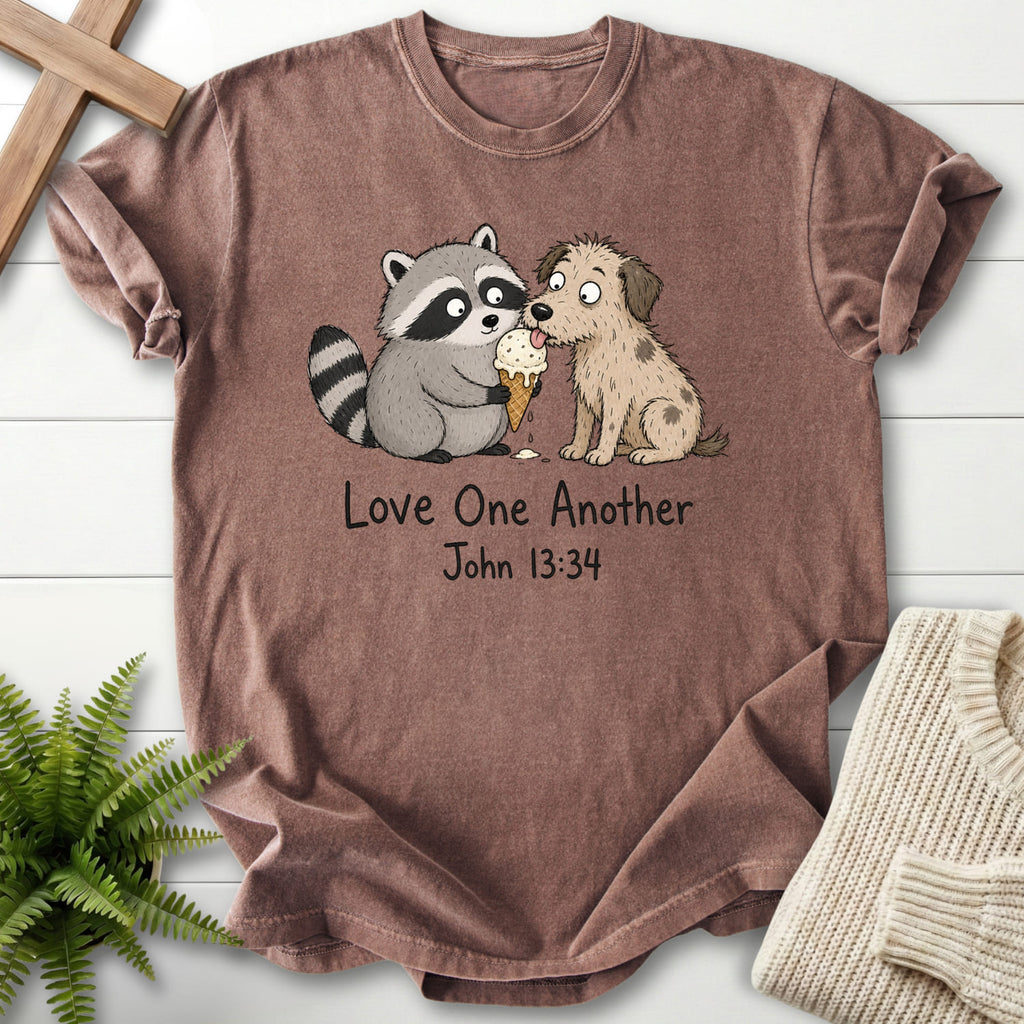 Flat lay of an Espresso Christian t-shirt for women featuring "Love One Another Raccoon Puppy T-Shirt" John 13:34 From Printify.