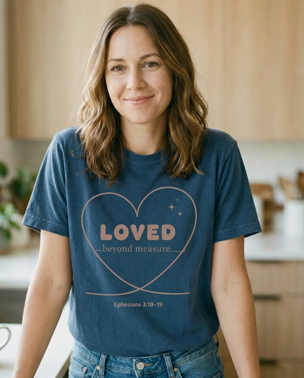 Loved Beyond Measure – Midnight women's Christian tee, lifestyle photo in morning kitchen setting – Simple heart outline illustration with 'LOVED beyond measure' text ins – Ephesians 3:18-19 – She Wears Faith