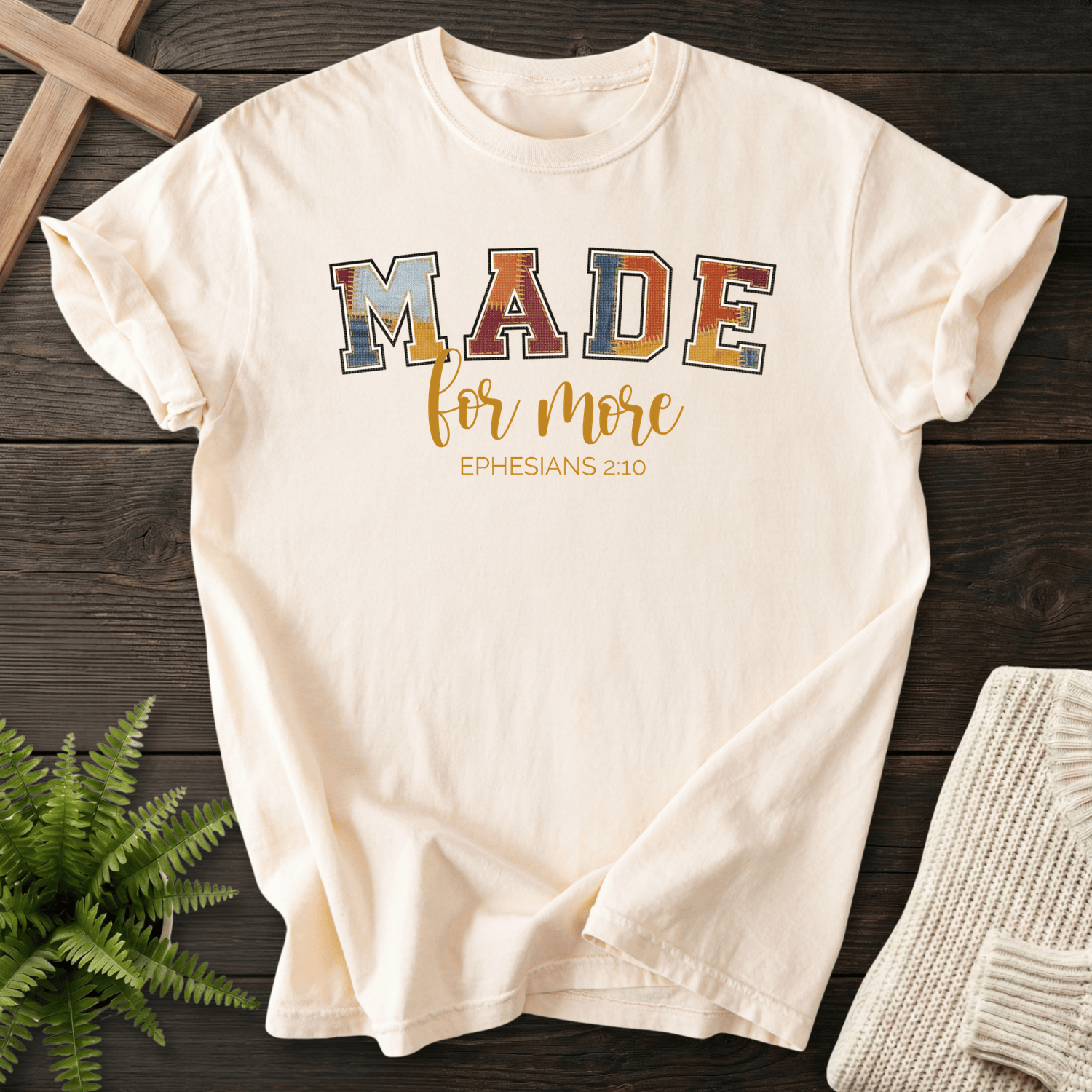Ivory women's Christian t-shirt with patchwork varsity lettering, inspired by Ephesians 2:10.
