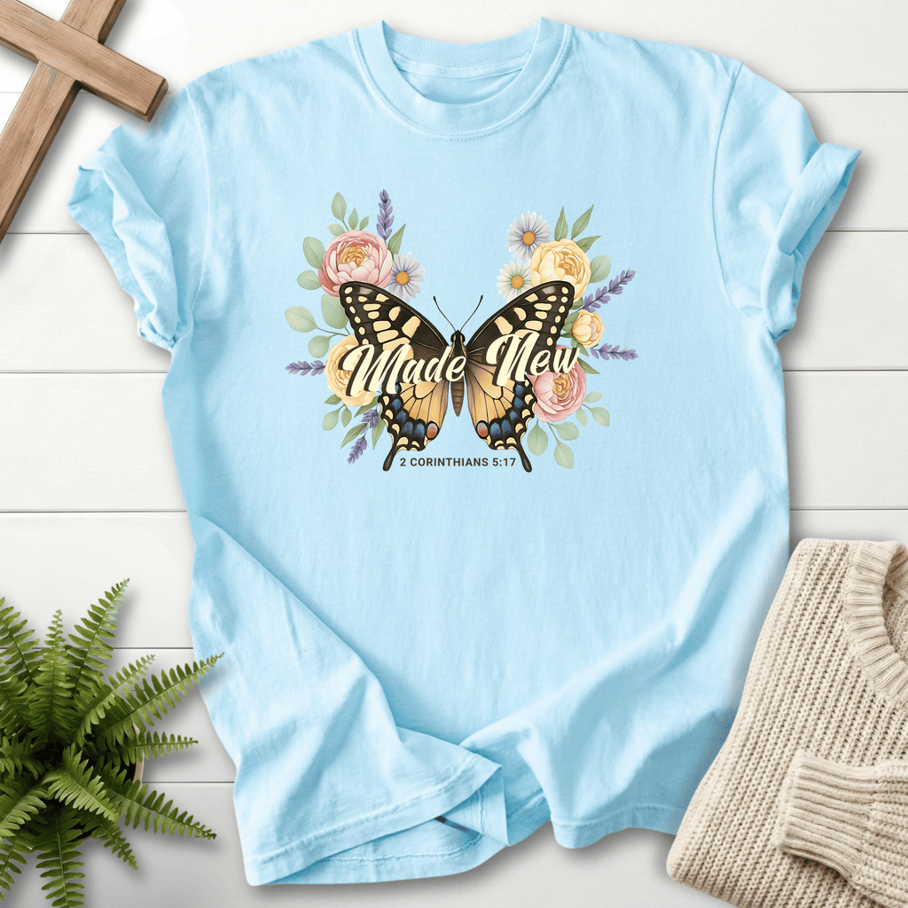 Chambray women's Bible verse tee with large butterfly and daisy wreath design, inspired by 2 Corinthians 5:17.