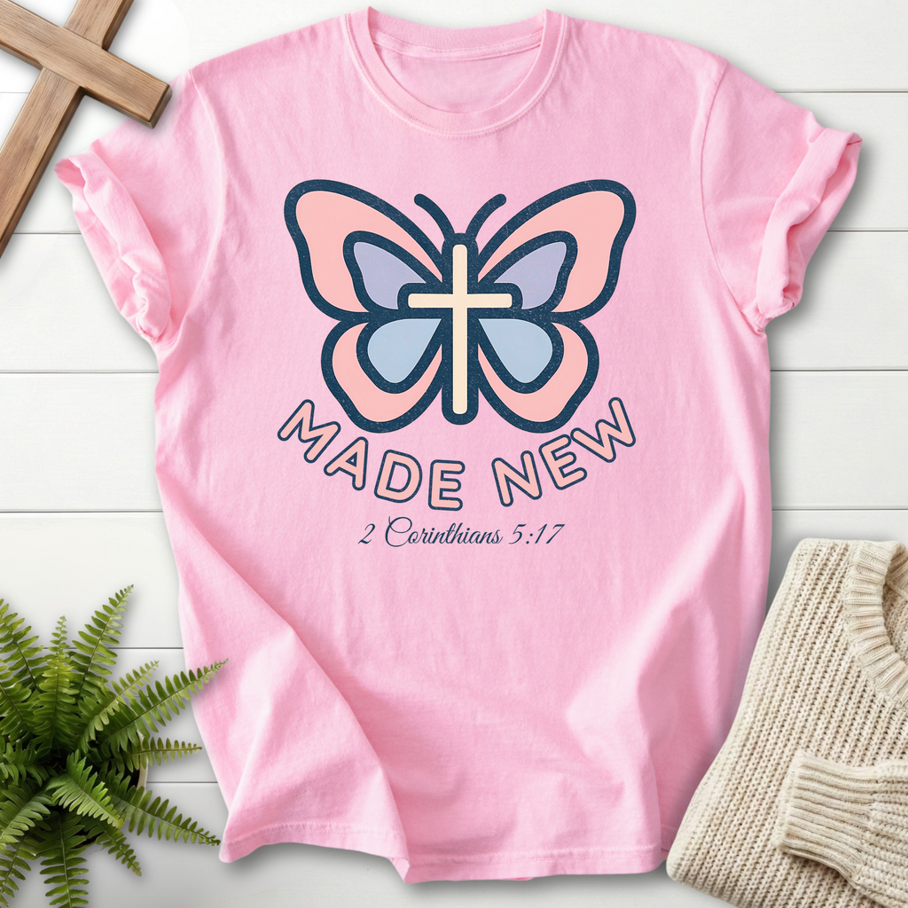 Blossom women's Christian t-shirt with pastel butterfly, cross body, and bold lettering, inspired by 2 Corinthians 5:17.