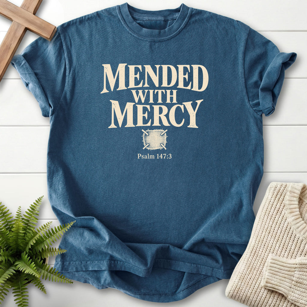Flatlay of a Midnight Comfort Colors 1717 women's Christian tee with "Mended with Mercy T-Shirt" Psalm 147:3.