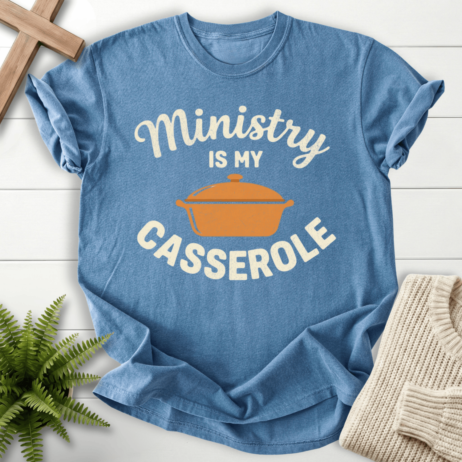 Blue Jean women's Christian t-shirt with illustrated casserole dish and garment-dyed finish.