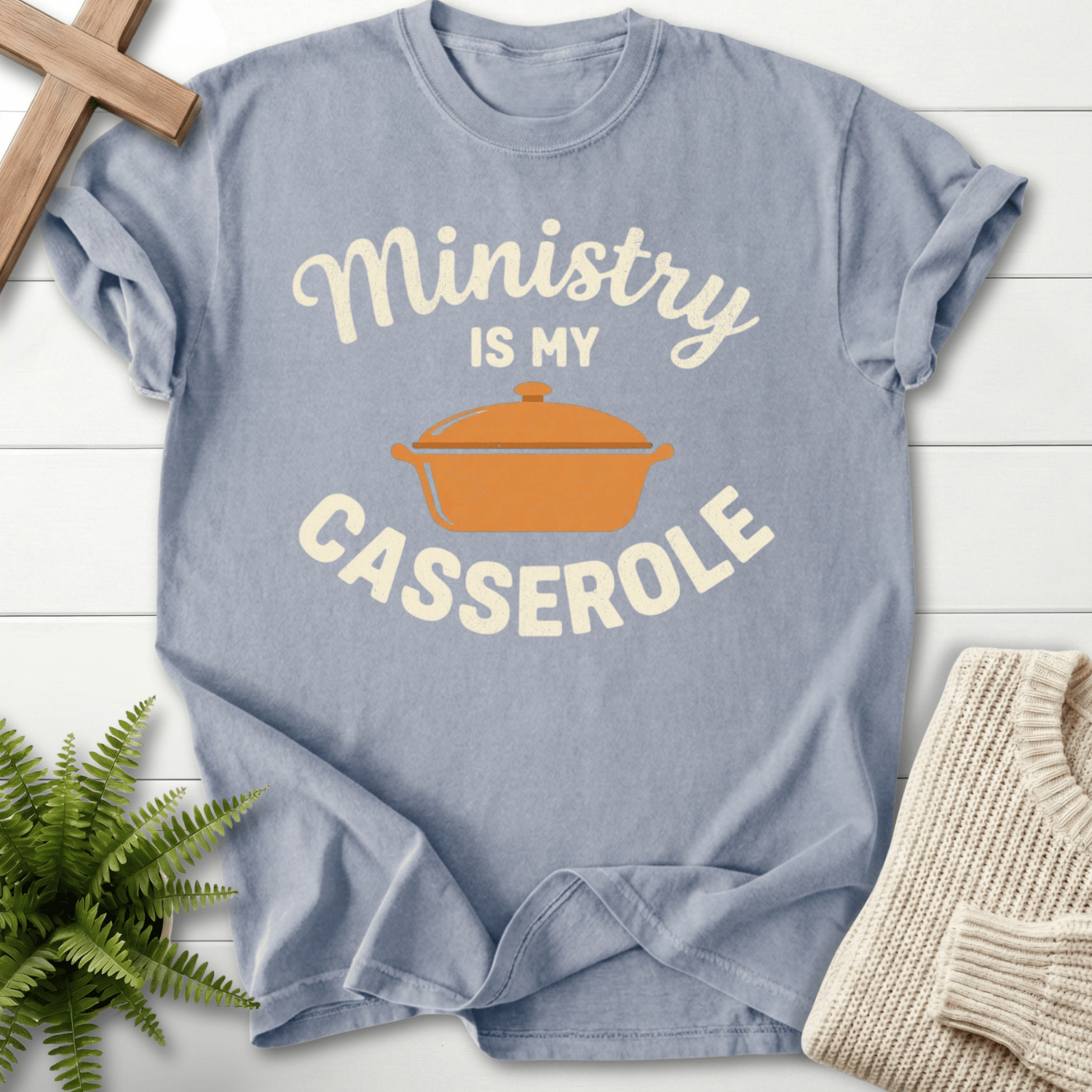 Granite women's Christian t-shirt with gold casserole illustration and warm ministry wording.