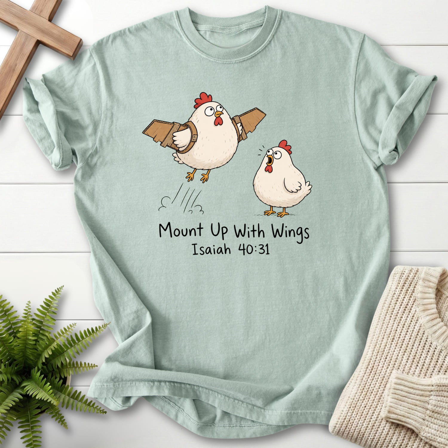 Flat lay of a Bay women's Christian tee featuring "Mount Up With Wings Isaiah 40:31 T-Shirt" Isaiah 40:31.