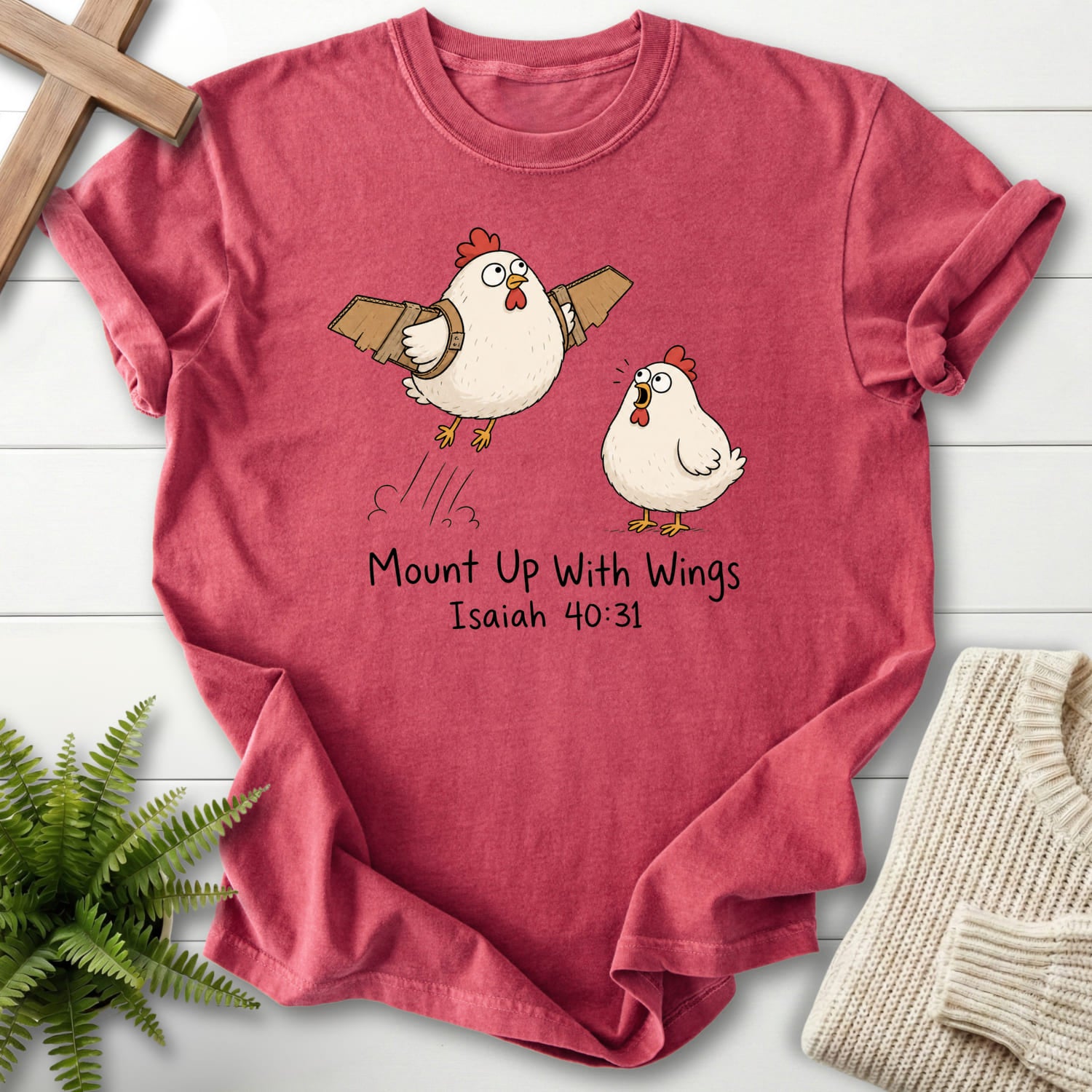 Flat lay of a Crimson Christian t-shirt for women featuring "Mount Up With Wings Isaiah 40:31 T-Shirt" Isaiah 40:31 From Printify.