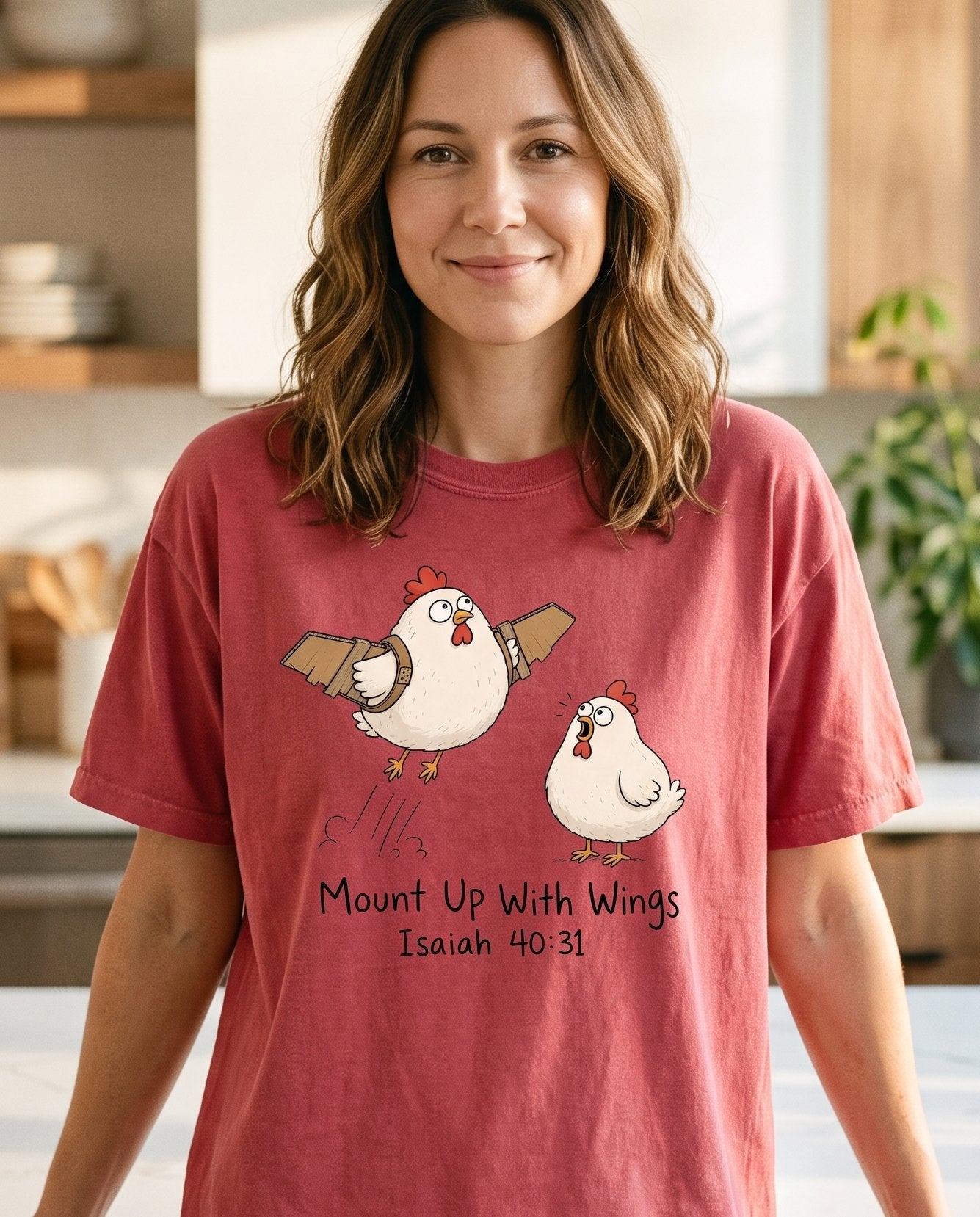 Mount Up With Wings Isaiah 40 31 – Crimson women's Christian tee, lifestyle photo in morning kitchen setting – Cartoon chicken strapping on cardboard wings while a second stunned ch – Isaiah 40:31 – She Wears Faith
