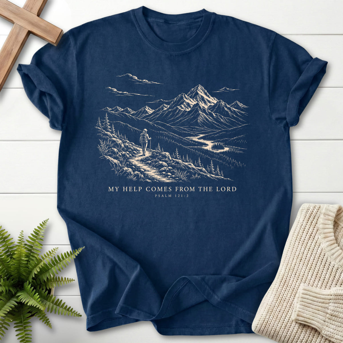 Flat lay of a Navy faith-inspired shirt featuring mountain graphic with "My Help Comes from the Lord T-Shirt".