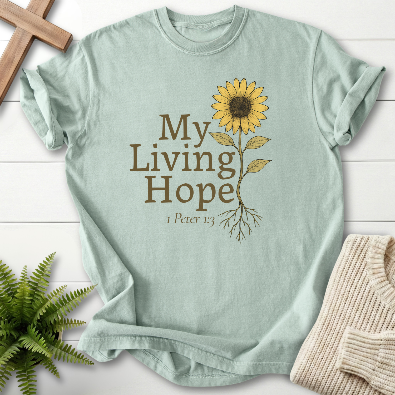 Bay women's faith t-shirt with rooted sunflower illustration and 'My Living Hope' verse, inspired by 1 Peter 1:3.