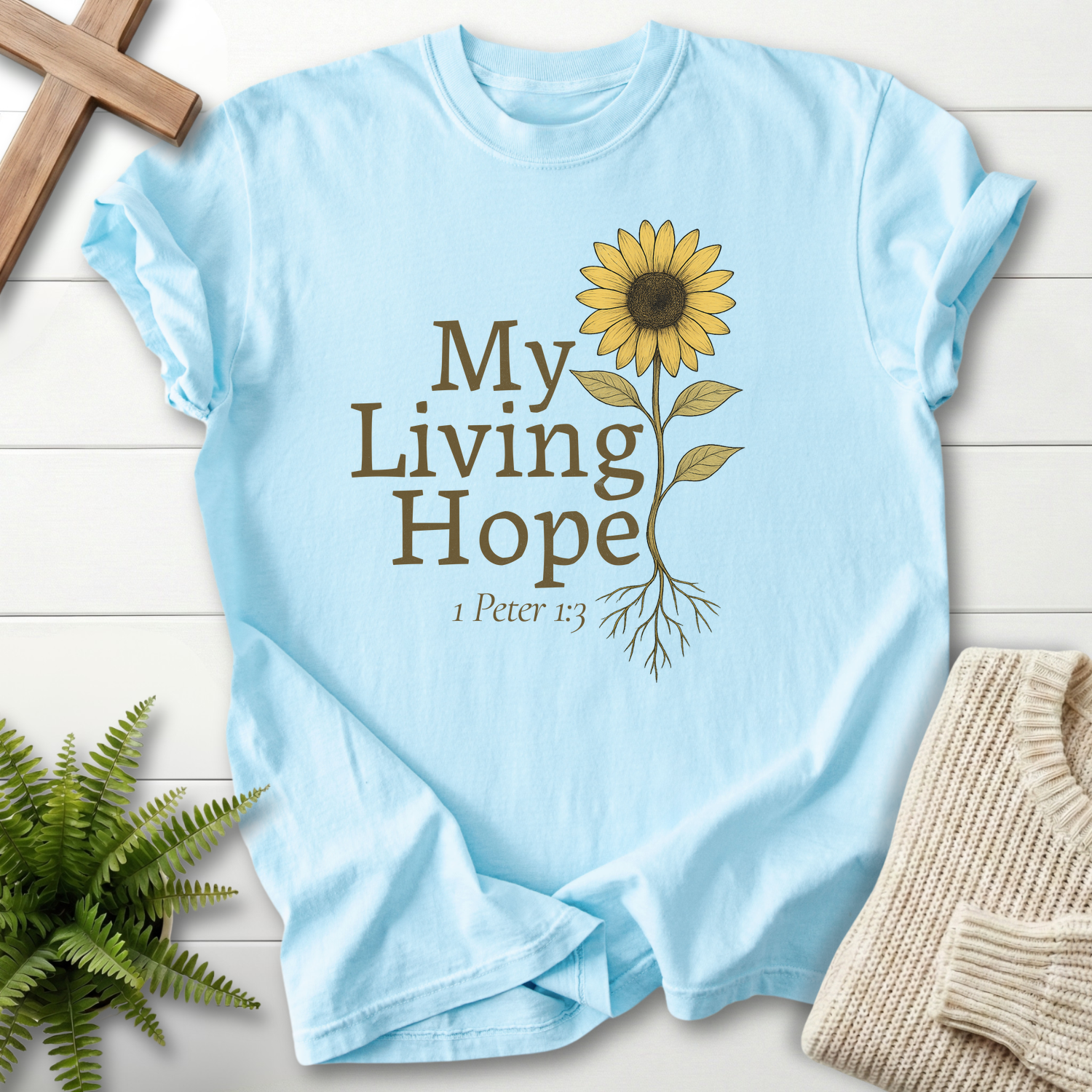 Chambray women's Bible verse tee with illustrated sunflower and 'My Living Hope' earthy lettering, inspired by 1 Peter 1:3.