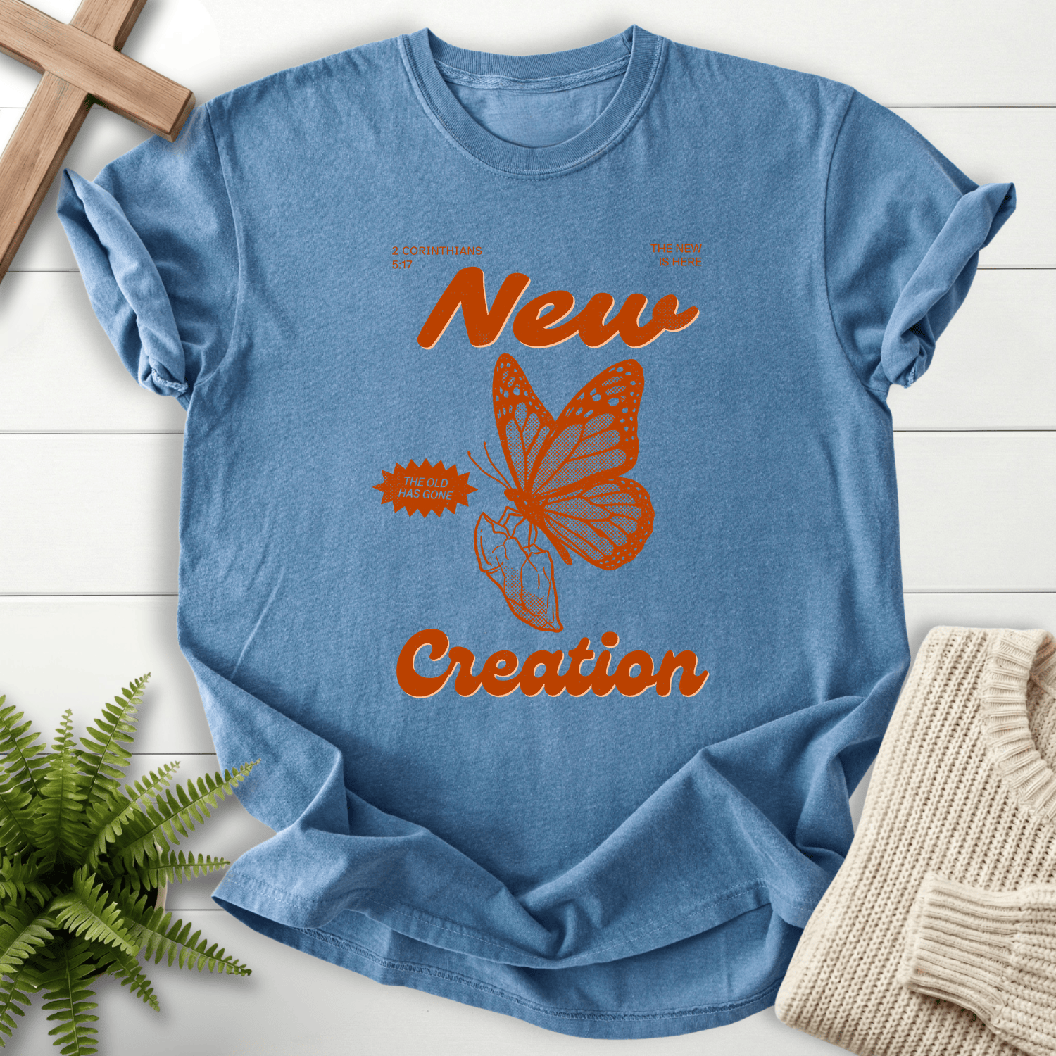 Blue Jean women's Christian t-shirt with retro butterfly 'New Creation' poster design, inspired by 2 Corinthians 5:17.