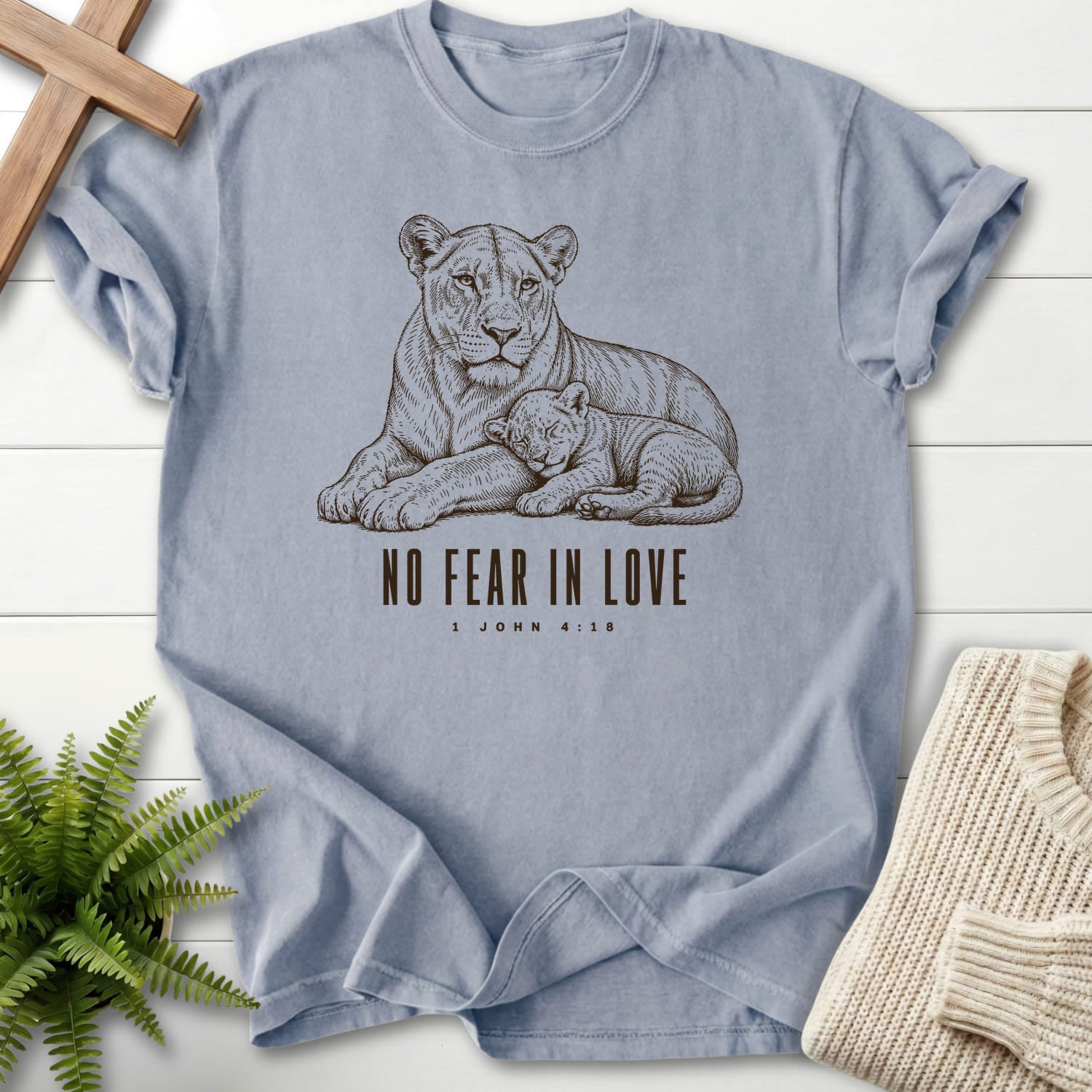 Flat lay of a Granite faith-inspired shirt featuring "No Fear in Love T-Shirt" 1 John 4:18.