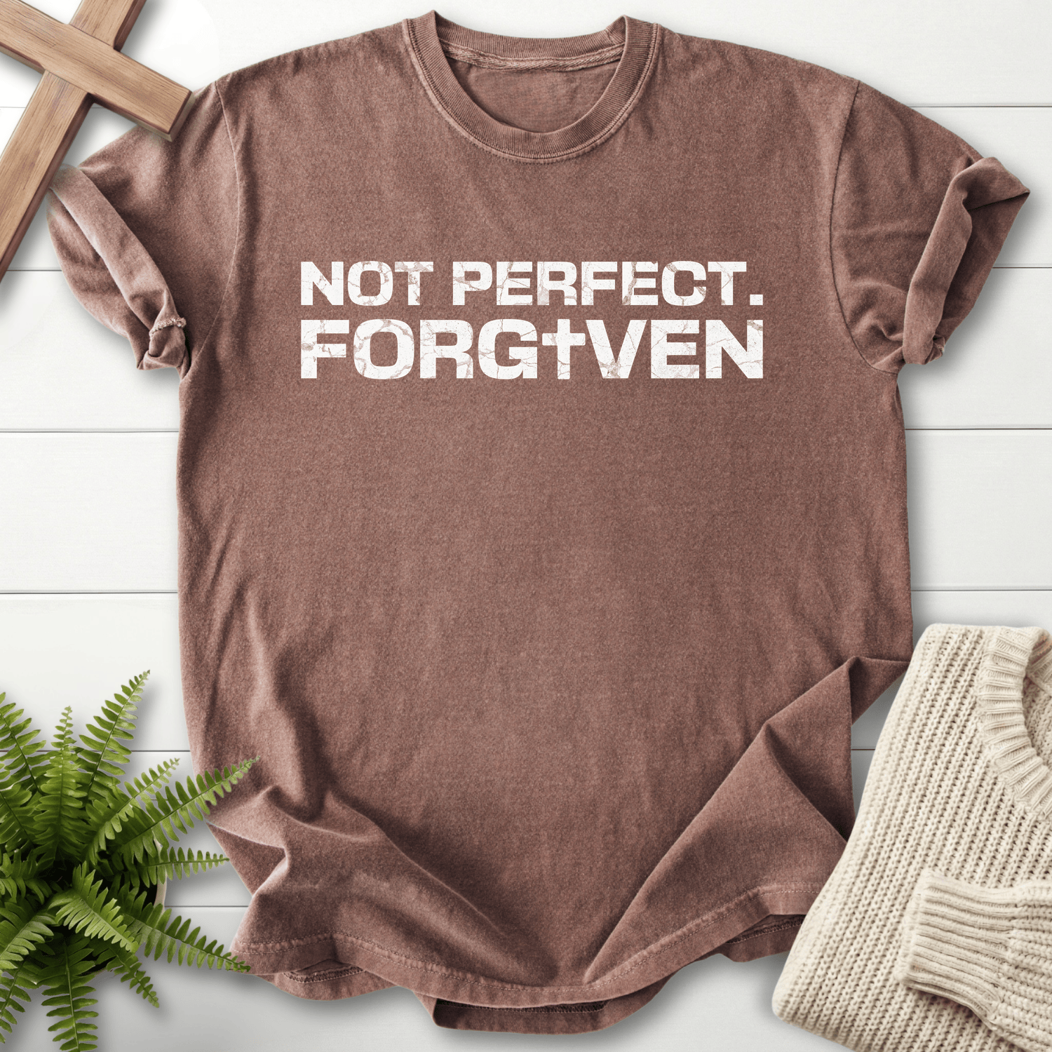 Espresso women's faith t-shirt with white distressed 'Not Perfect. Forgiven' grunge text and cross detail.