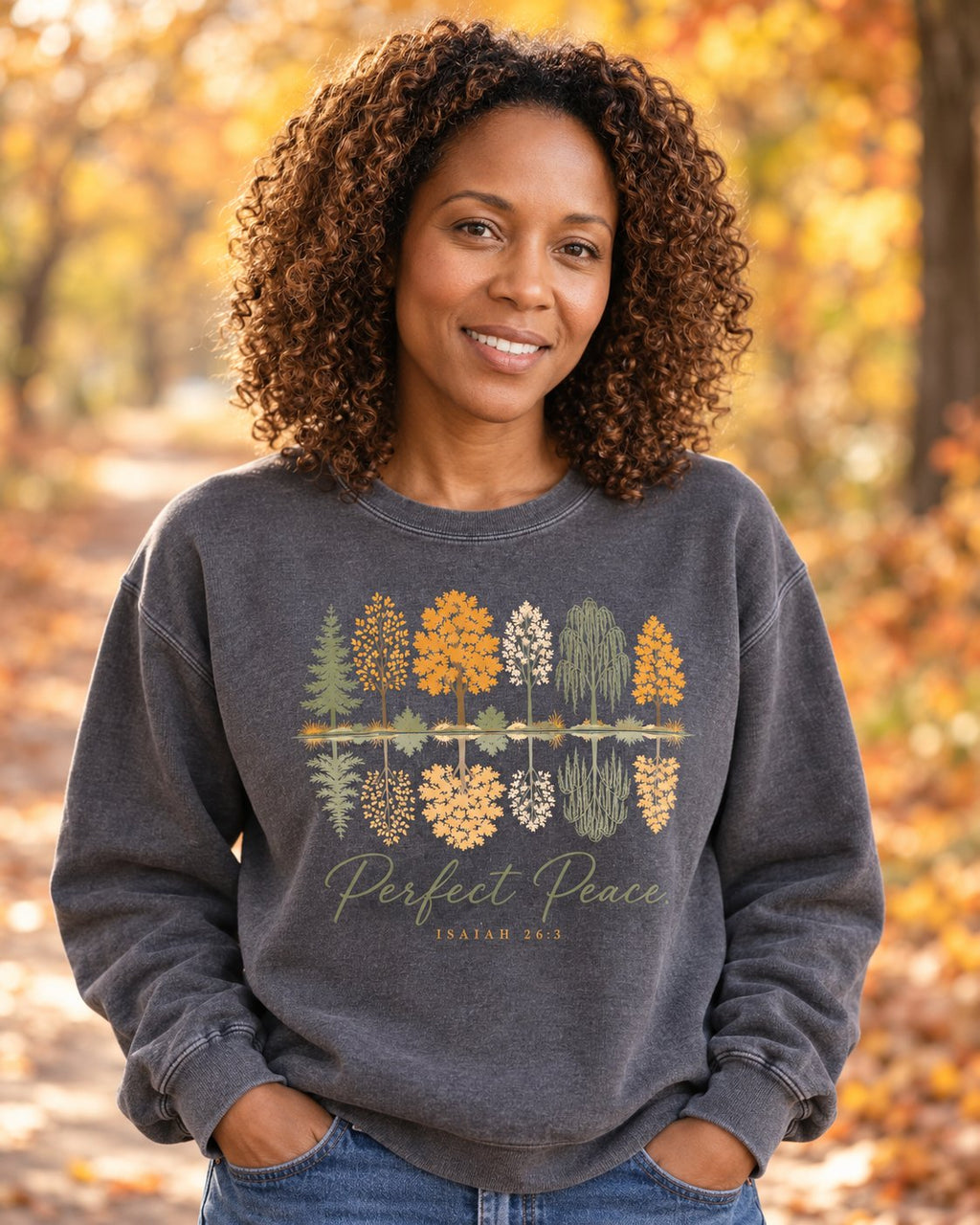 Perfect Peace Isaiah 26:3 – Pepper women's Christian sweatshirt, lifestyle photo in cozy autumn harvest setting – Autumn tree reflections above Perfect Peace script – She Wears Faith