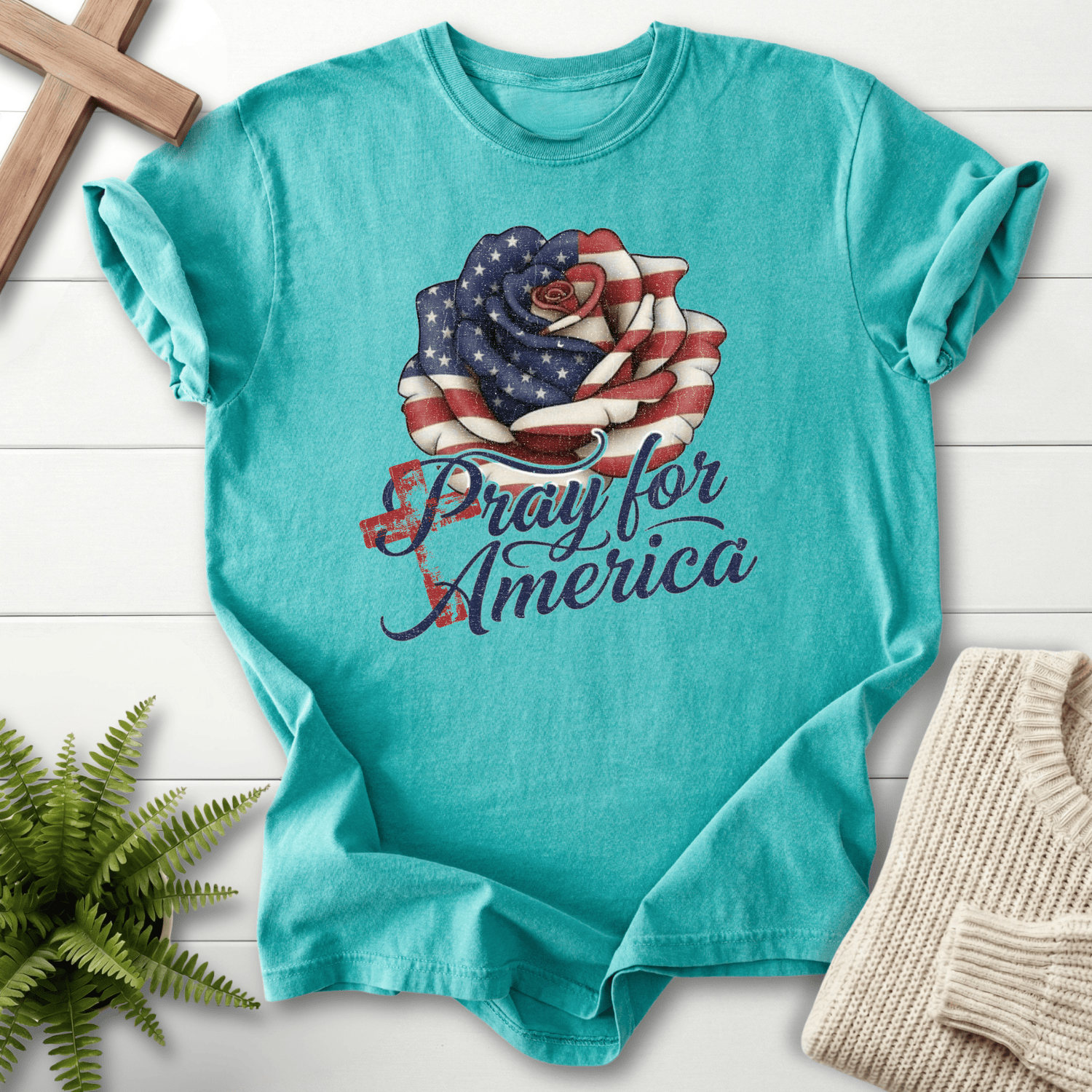 Seafoam women's Christian t-shirt with patriotic flag rose and "Pray for America" navy script.