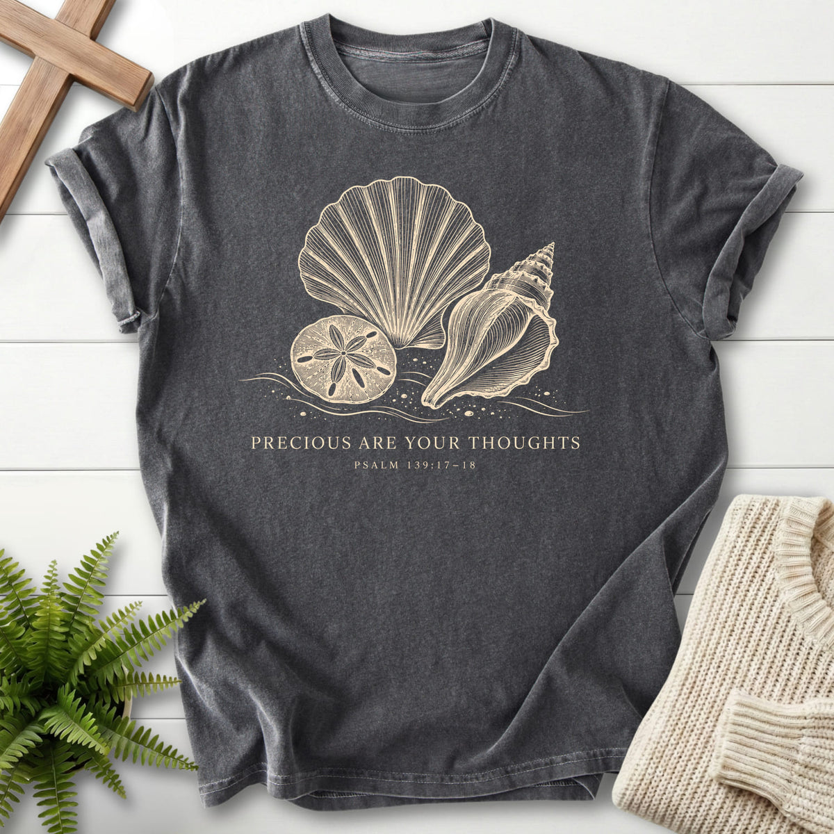 Flatlay of a Pepper faith-inspired shirt with "Precious Are Your Thoughts T-Shirt" design.