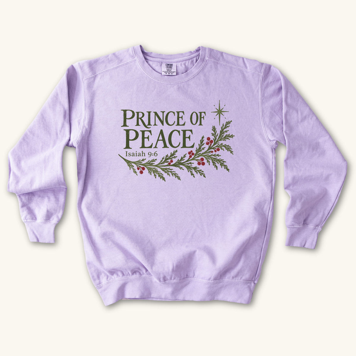 Orchid Christian Christmas sweatshirt with Prince of Peace lettering, an evergreen branch with red berries, a star and Isaiah 9:6.