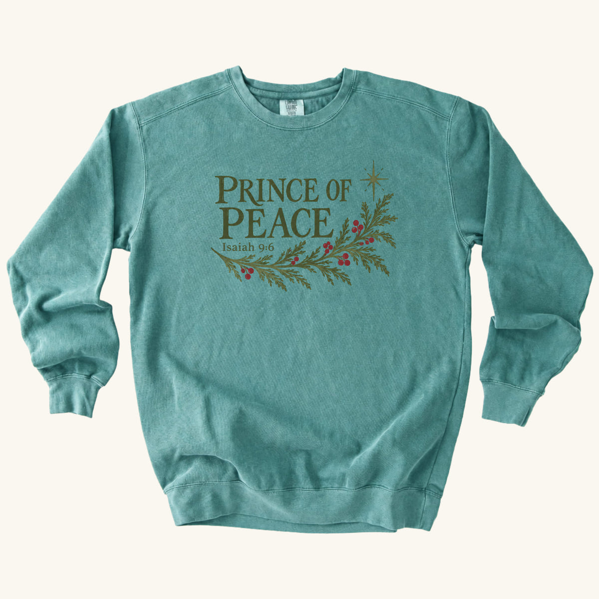 Seafoam Christian Christmas sweatshirt with Prince of Peace lettering, an evergreen branch with red berries, a star and Isaiah 9:6.