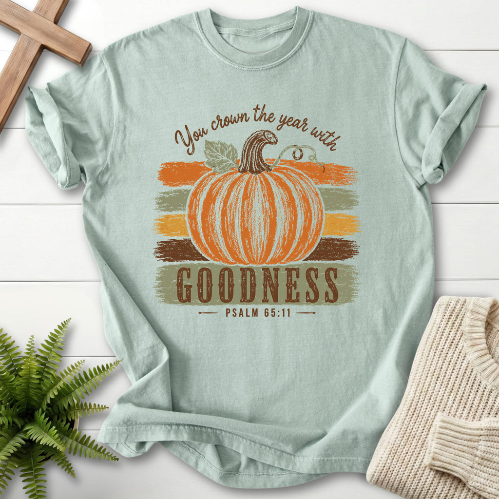 Flat lay of a Bay Comfort Colors 1717 garment-dyed Christian tee featuring "Pumpkin Goodness Psalm 65 11 Goodness T-Shirt" Psalm 65:11 From Printify.