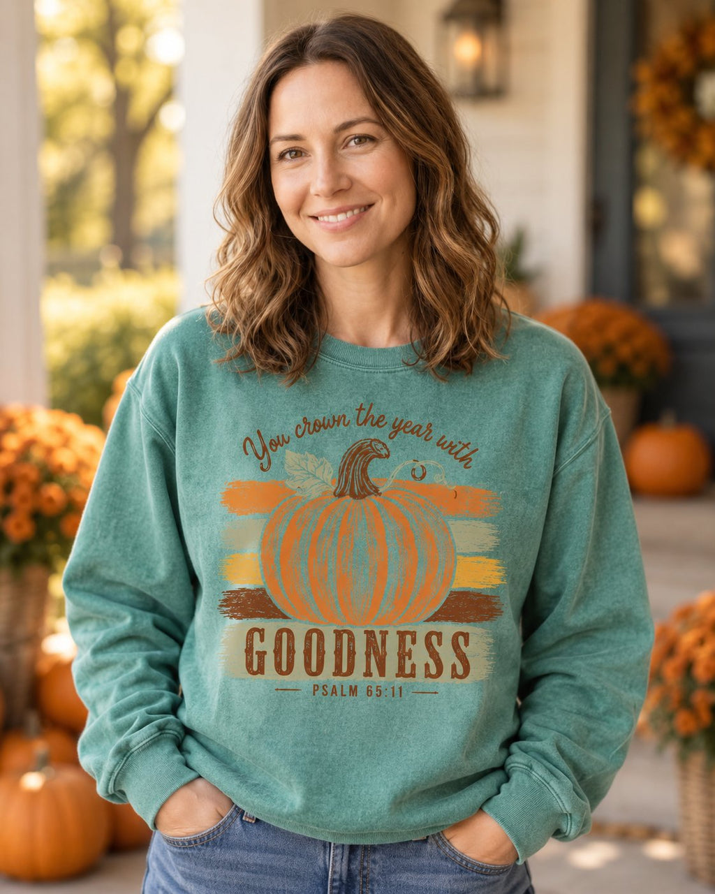 Pumpkin Goodness Psalm 65:11 – Light Green women's Christian sweatshirt, lifestyle photo in cozy autumn harvest setting – Orange pumpkin on painted stripes with GOODNESS – She Wears Faith