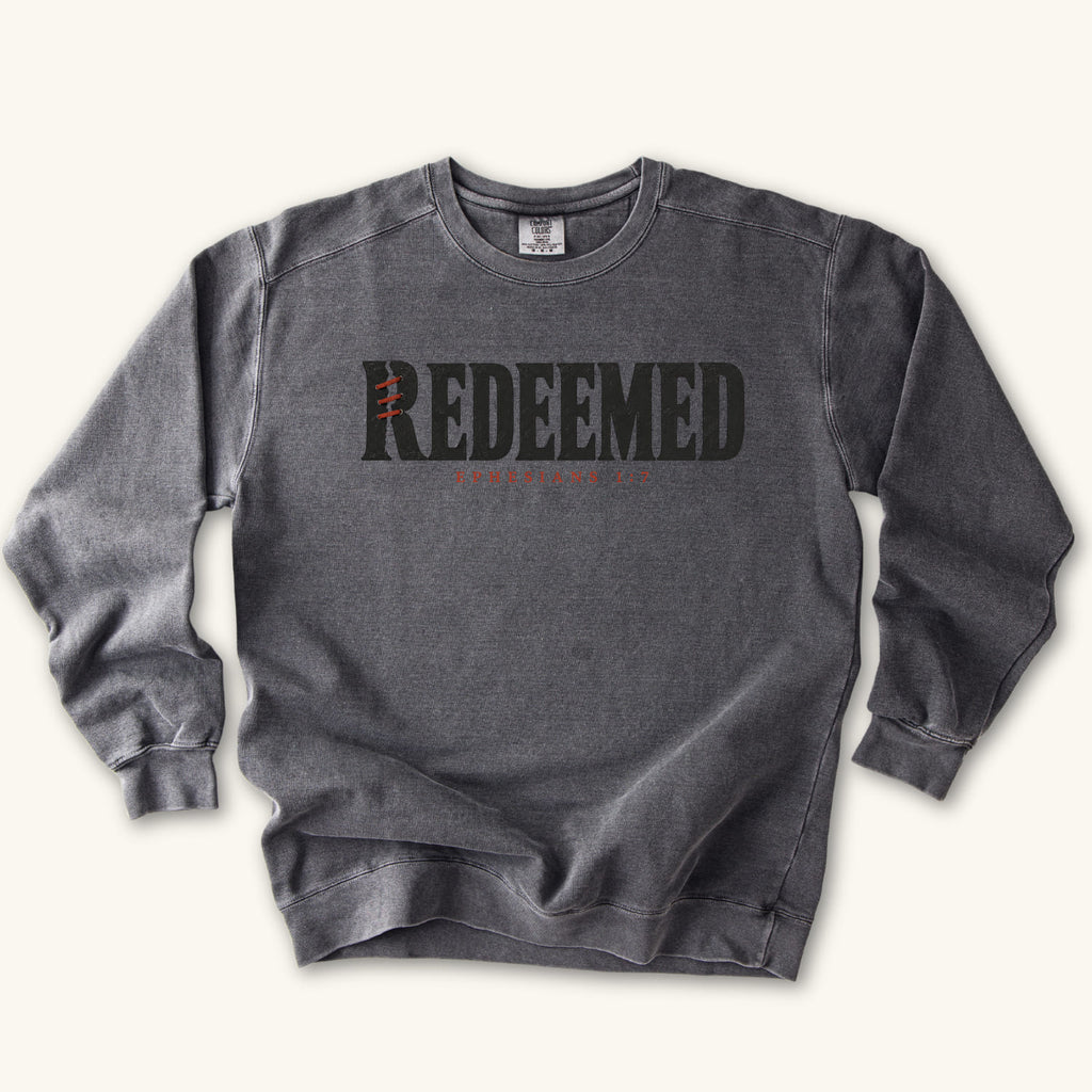 Pepper Redeemed sweatshirt flat lay mockup, Ephesians 1:7 Christian apparel for women