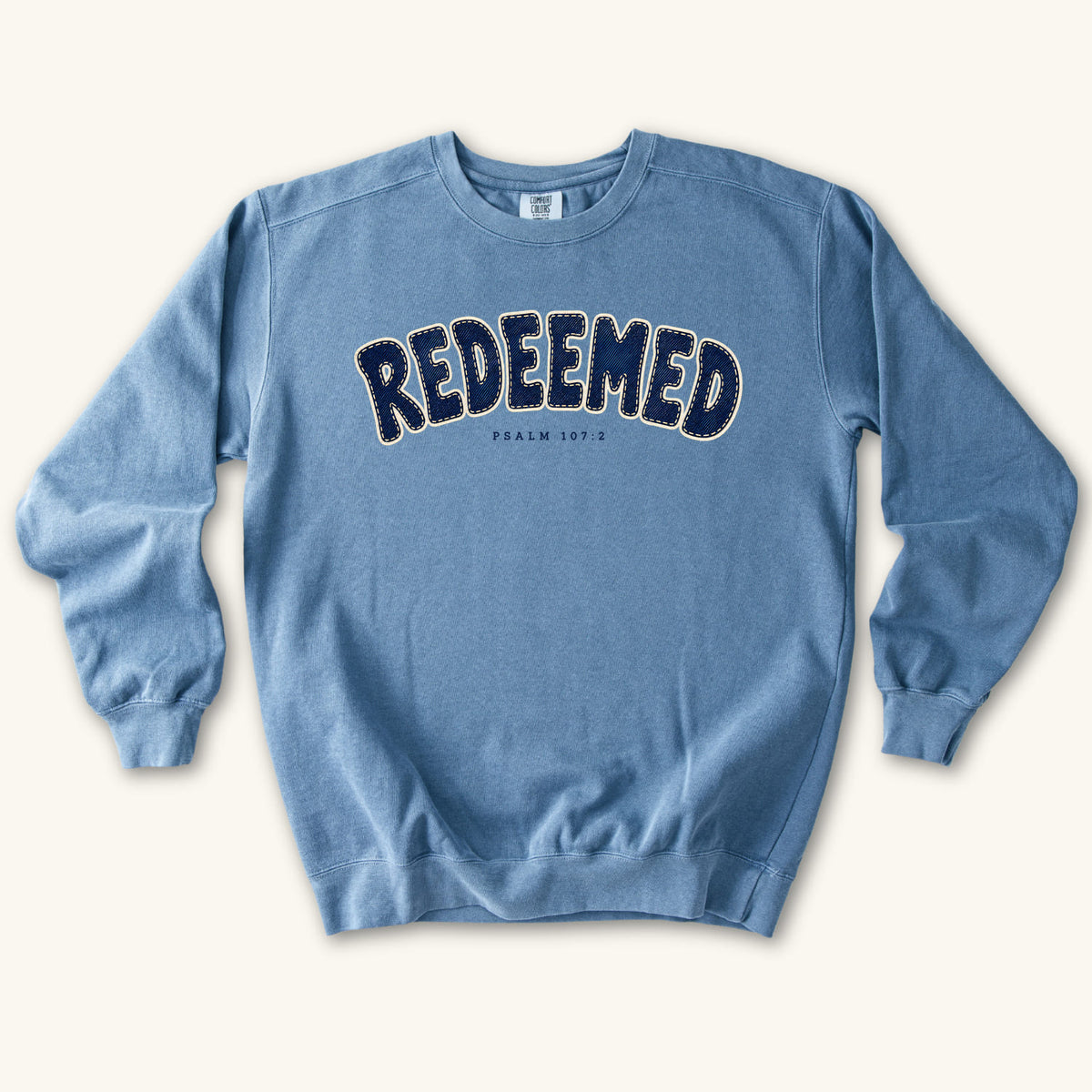 Blue Jean Redeemed sweatshirt flat lay mockup, Psalm 107:2 Christian apparel for women