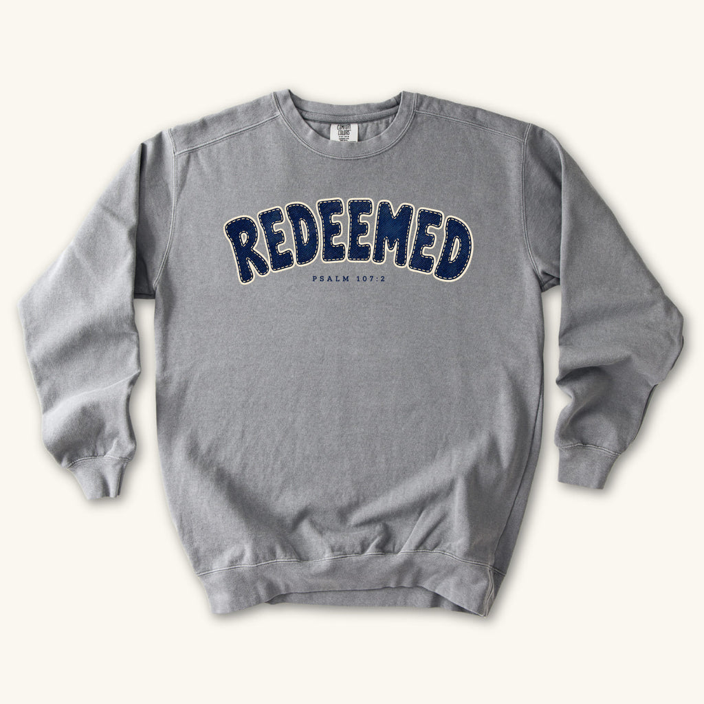 Grey Redeemed sweatshirt flat lay mockup, Psalm 107:2 Christian apparel for women
