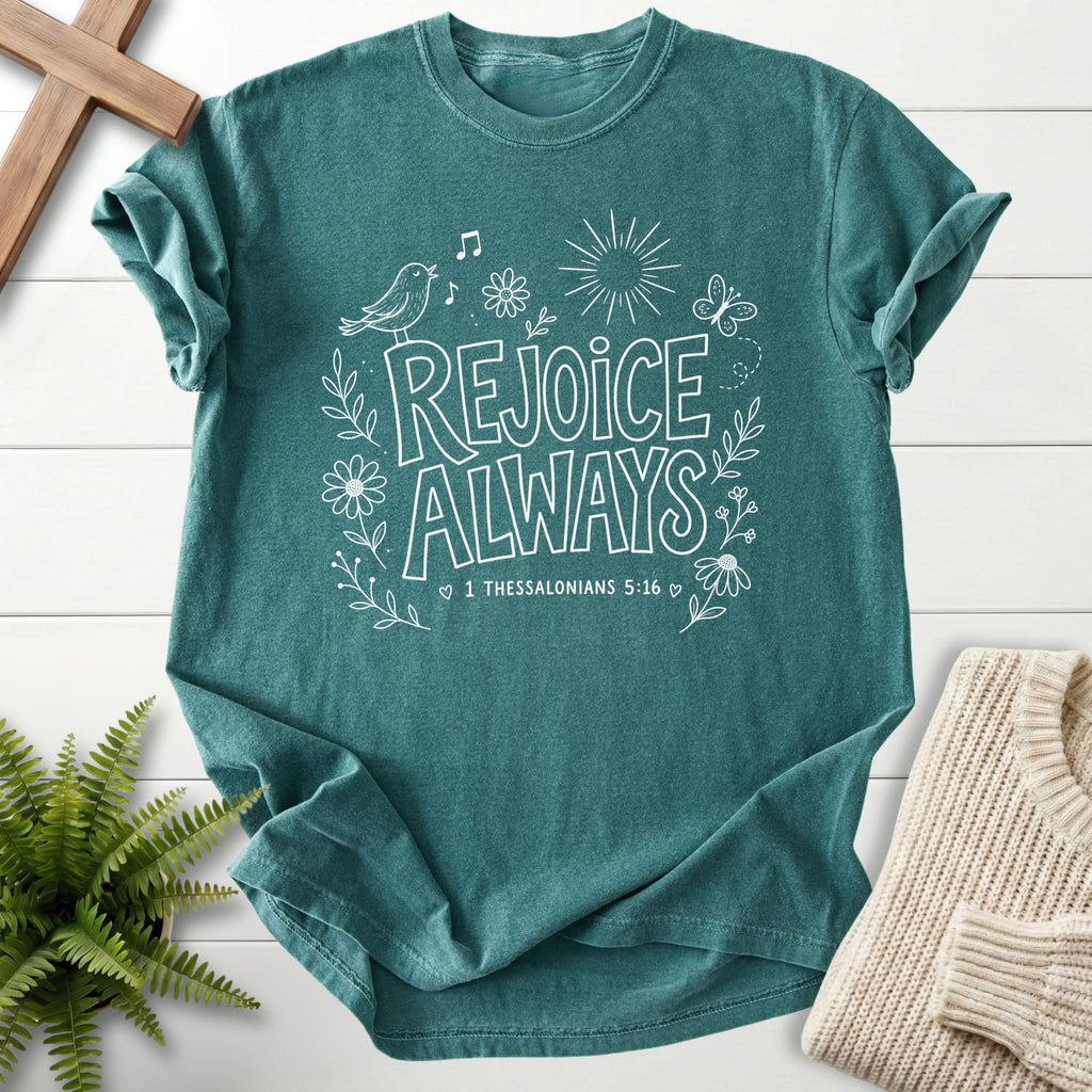 Flatlay of a Blue Spruce faith-based tee with butterfly artwork with "Rejoice Always T-Shirt" 1 Thessalonians 5:16.