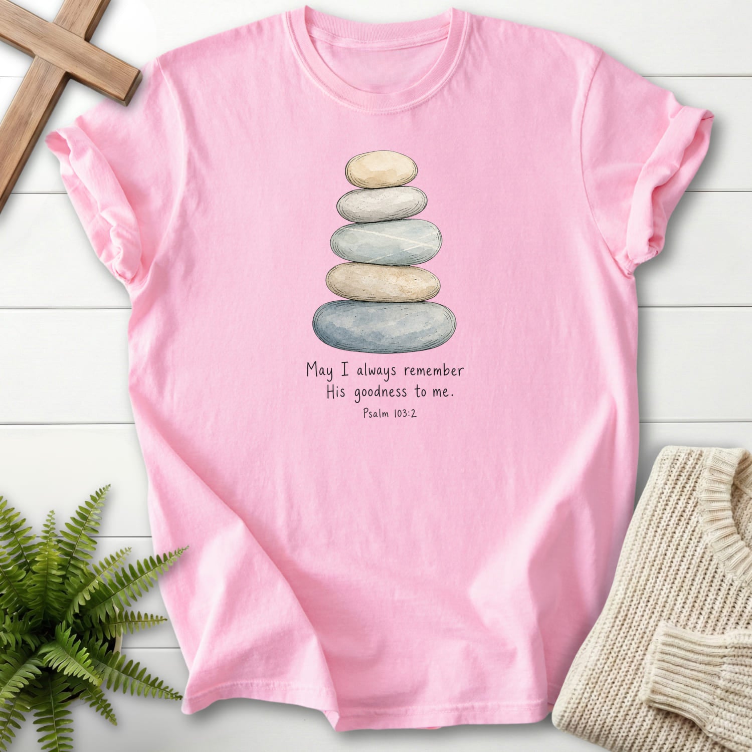 Flat lay of a Blossom women's Christian tee featuring "Remember His Goodness Dark T-Shirt" Psalm 103:2.