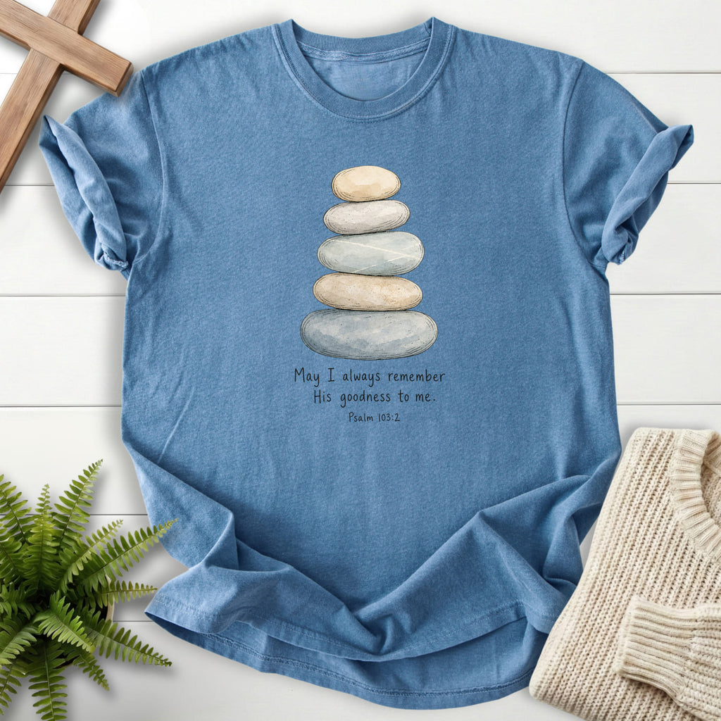 Flatlay of a Blue Jean faith-inspired shirt with "Remember His Goodness Dark T-Shirt" Psalm 103:2.