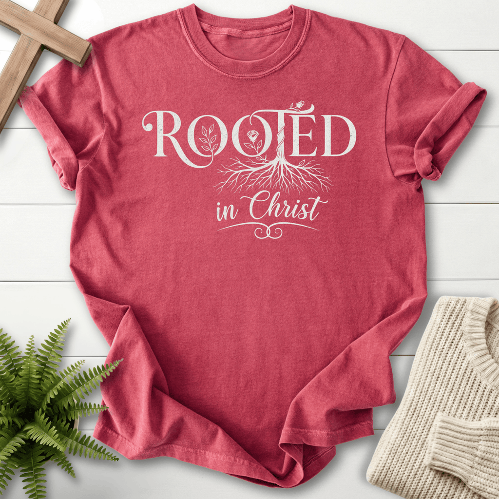 Crimson women's Christian t-shirt with Rooted in Christ lettering and botanical tree roots.