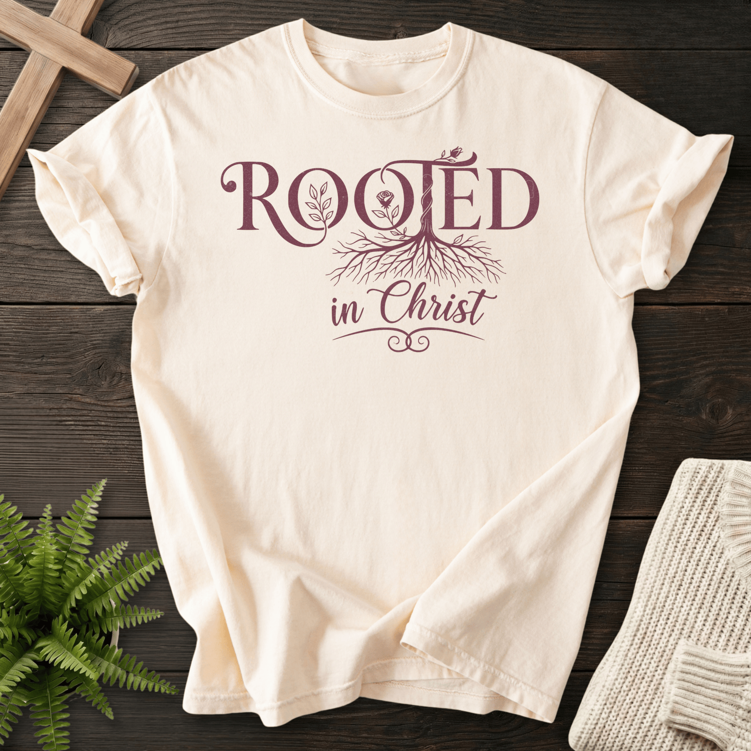 Ivory women's Christian t-shirt with "Rooted in Christ" botanical tree and roots design.