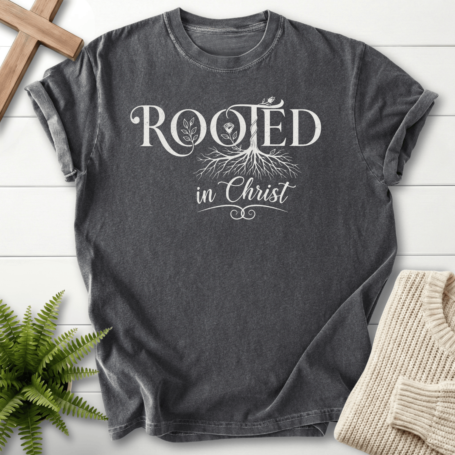 Pepper women's Scripture shirt with "Rooted in Christ" botanical tree illustration.