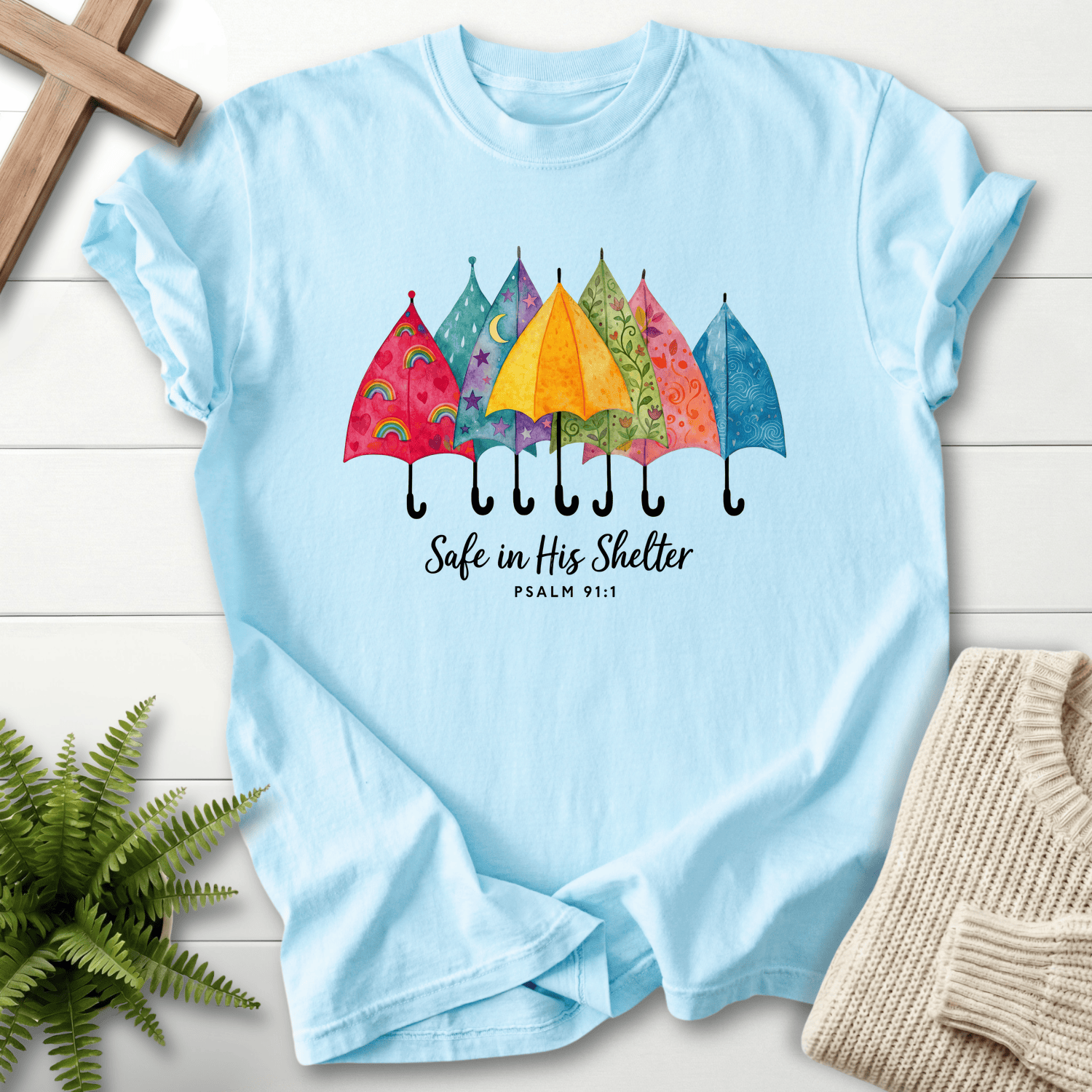 Chambray women's Christian t-shirt with colorful watercolor umbrellas, inspired by Psalm 91:1.