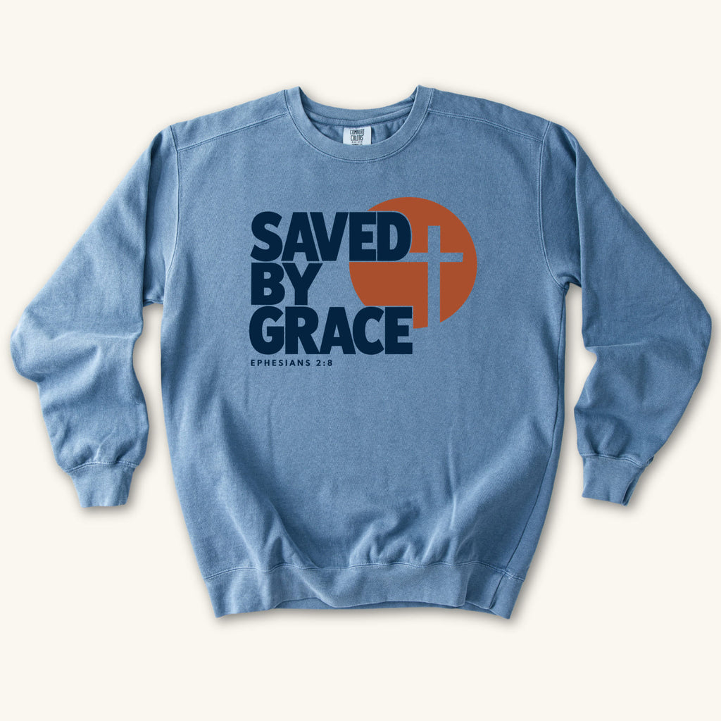 Blue Jean Saved by Grace Bold Cross sweatshirt flat lay mockup, Ephesians 2:8 Christian apparel for women