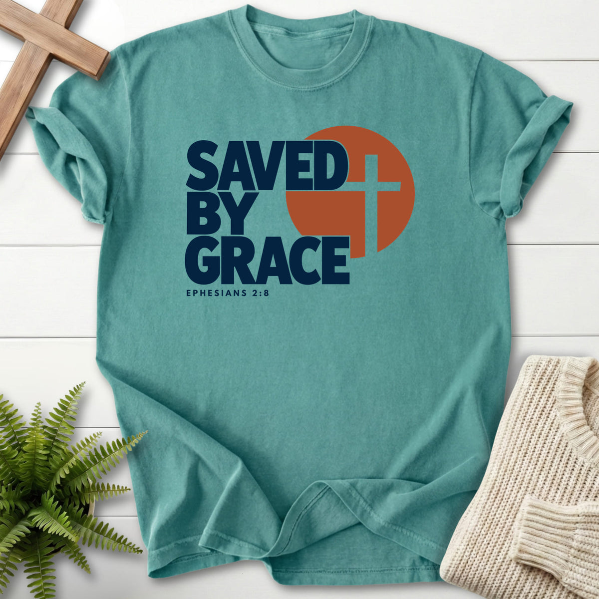 Chalky Mint Saved by Grace Bold Cross T-shirt flat lay mockup, Ephesians 2:8 Christian apparel for women