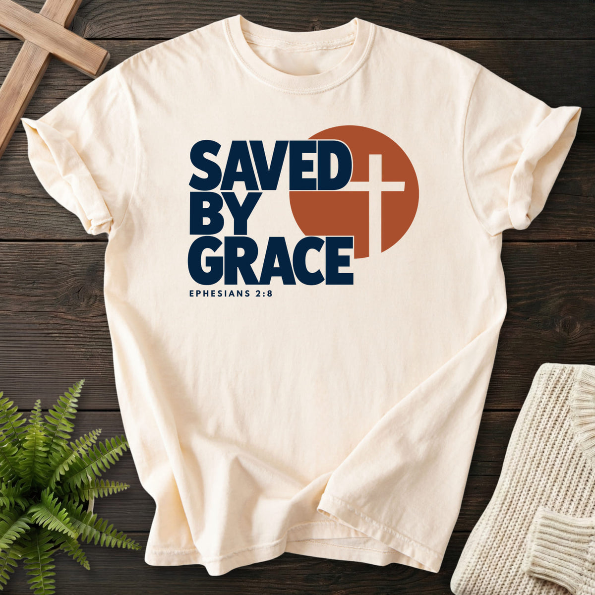 Ivory Saved by Grace Bold Cross T-shirt flat lay mockup, Ephesians 2:8 Christian apparel for women