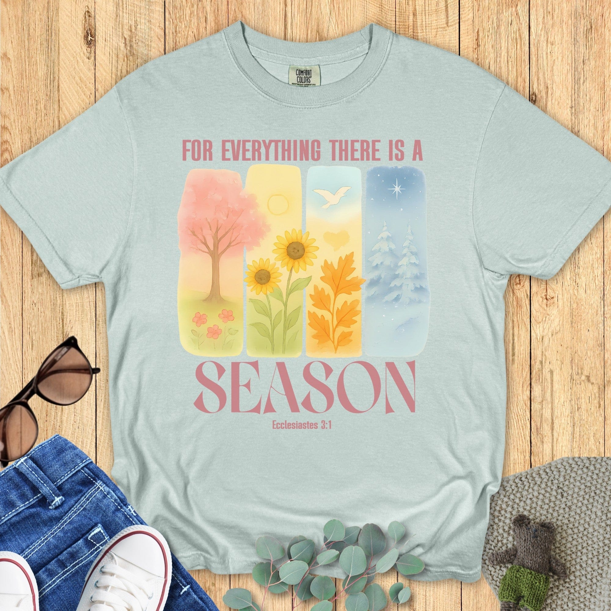 Comfort Colors 1717 bay “For Everything There Is a Season – Ecclesiastes 3:1” t-shirt with soft watercolor art of spring, summer, fall, and winter. A modern Christian shirt and thoughtful Christian mom gift idea.